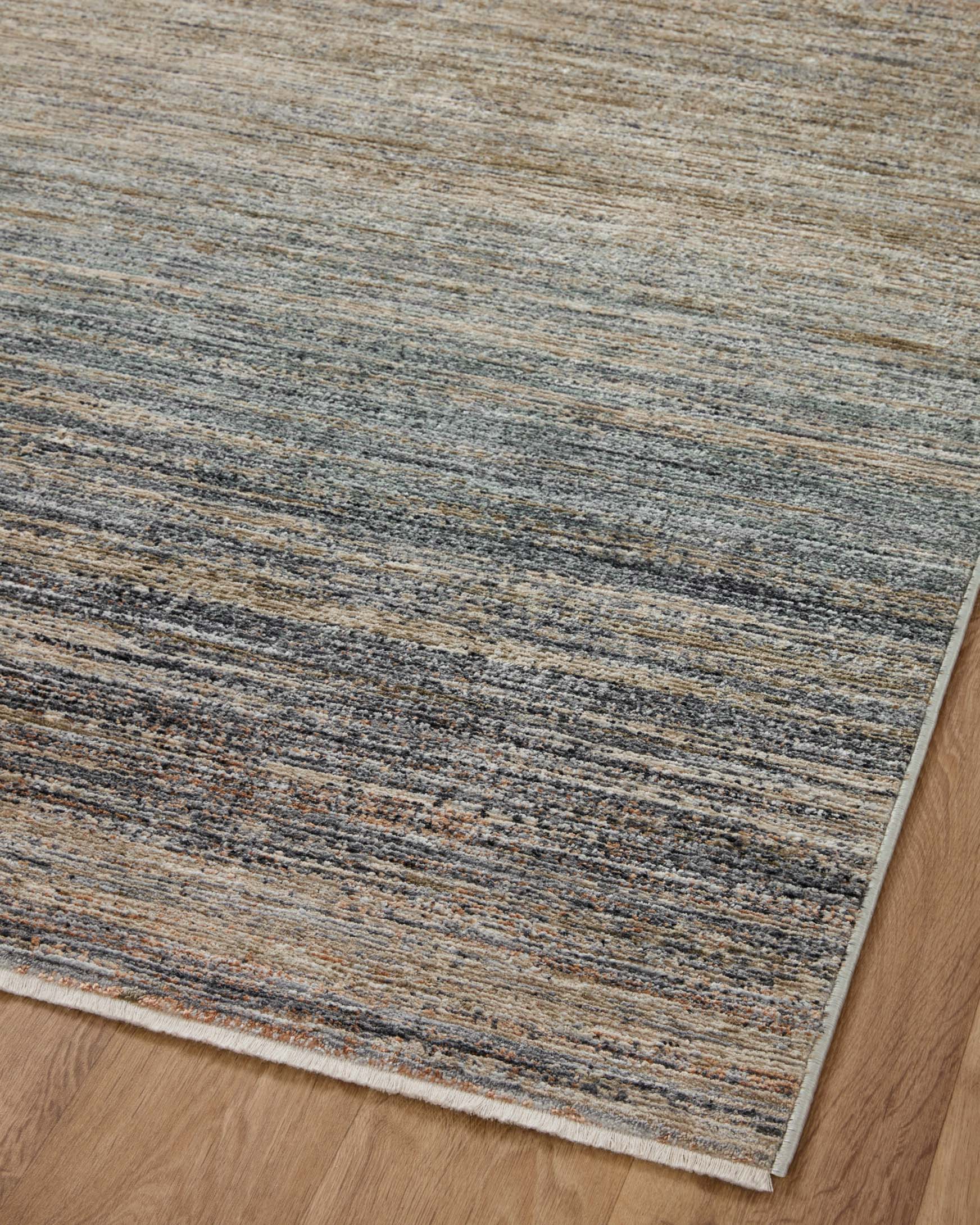 Textured accent rug with horizontal stripes in beige, gray, and blue, low profile