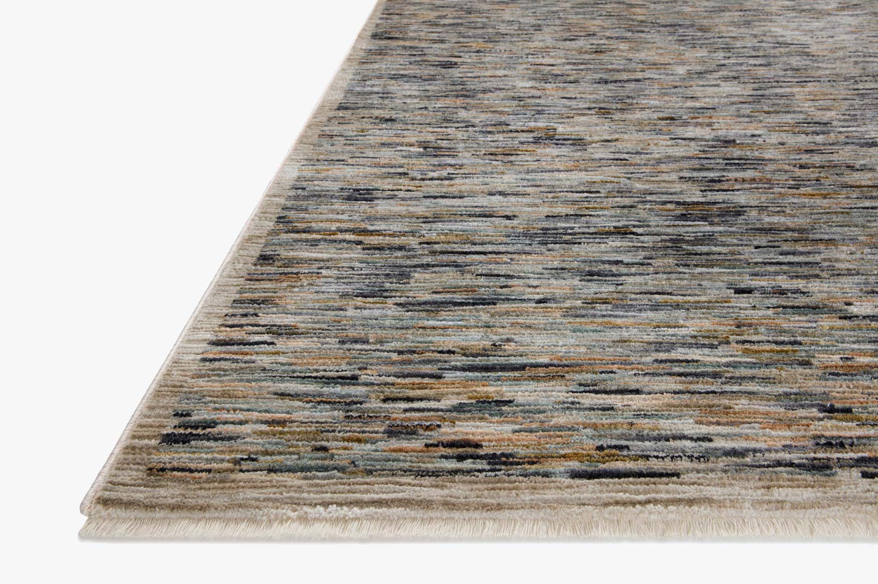 Corner view of multicolor striped accent rug with short fringe and low-pile surface