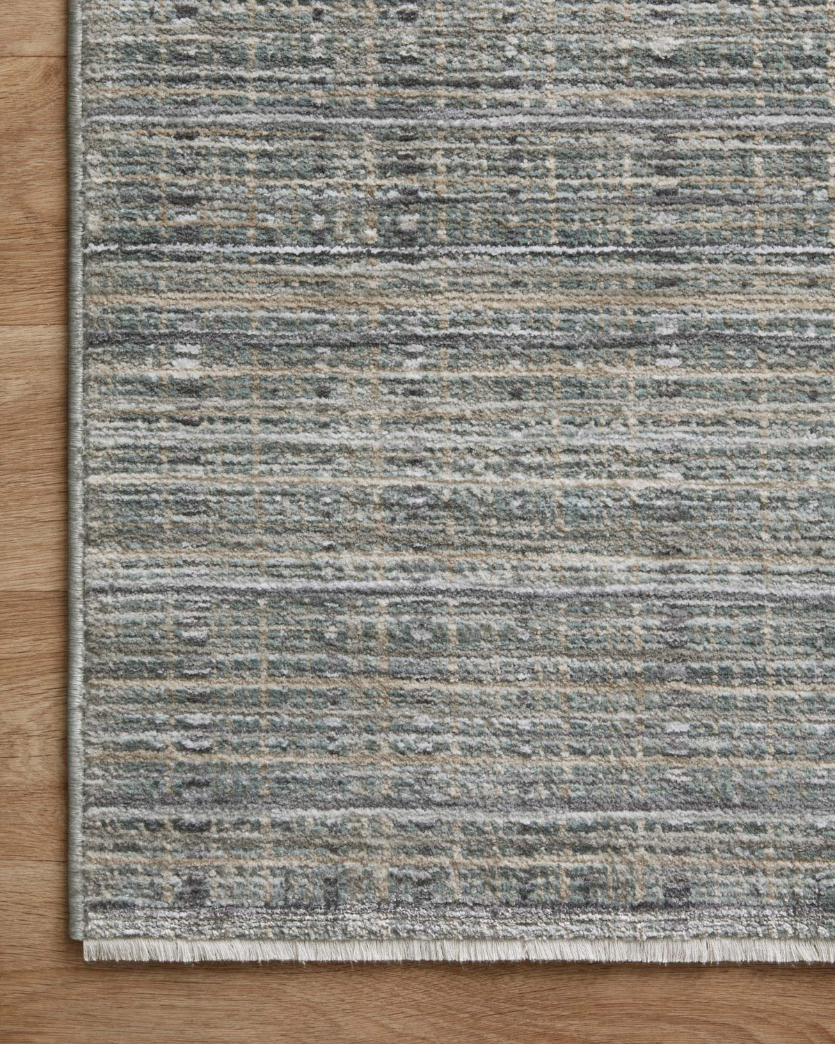Blue and gray flatweave area rug with distressed horizontal stripes and textured surface