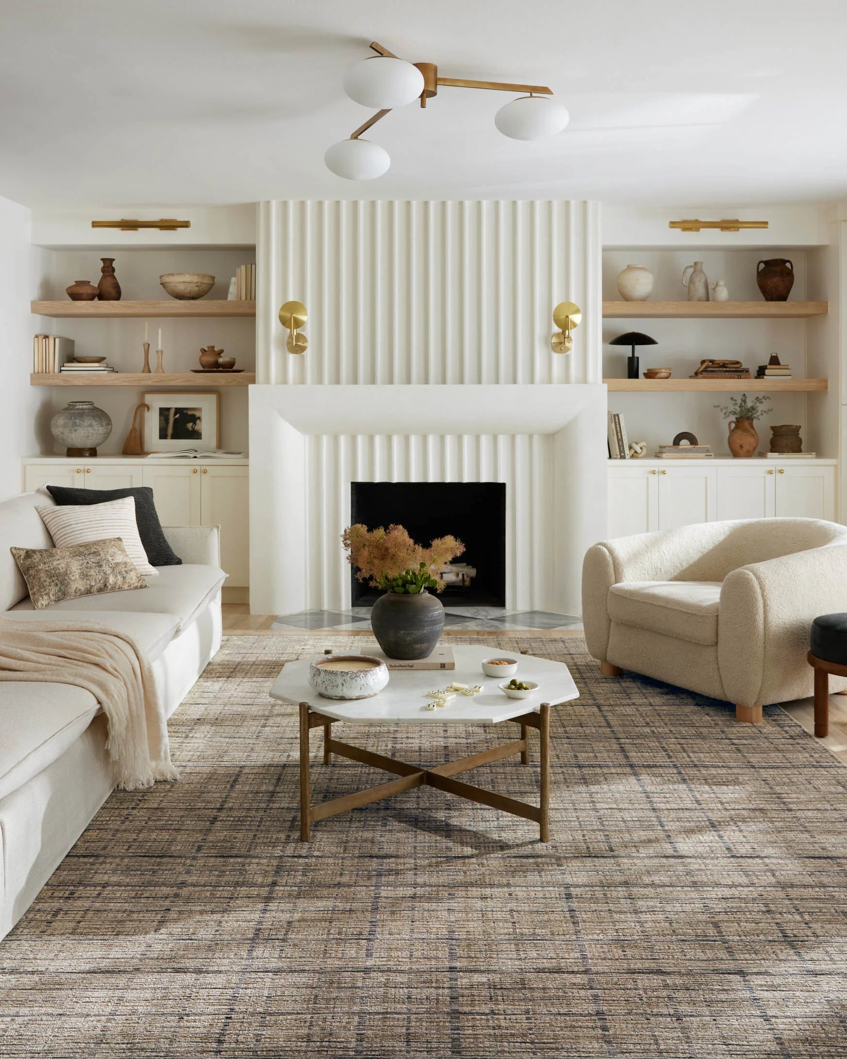 Peeble-beige and charcoal area rug with textured horizontal stripes under living room seating