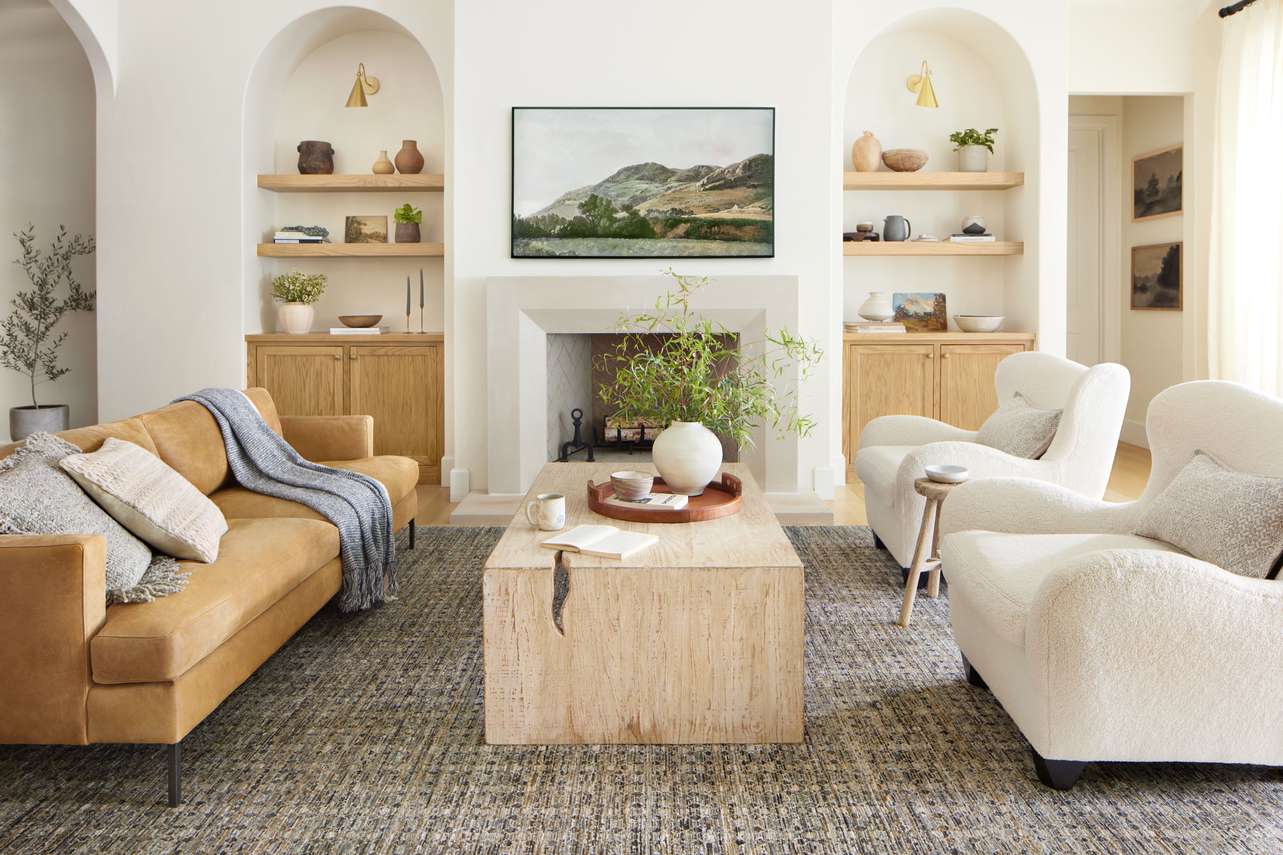 Charcoal and cream area rug in bright living room, textured surface under chairs