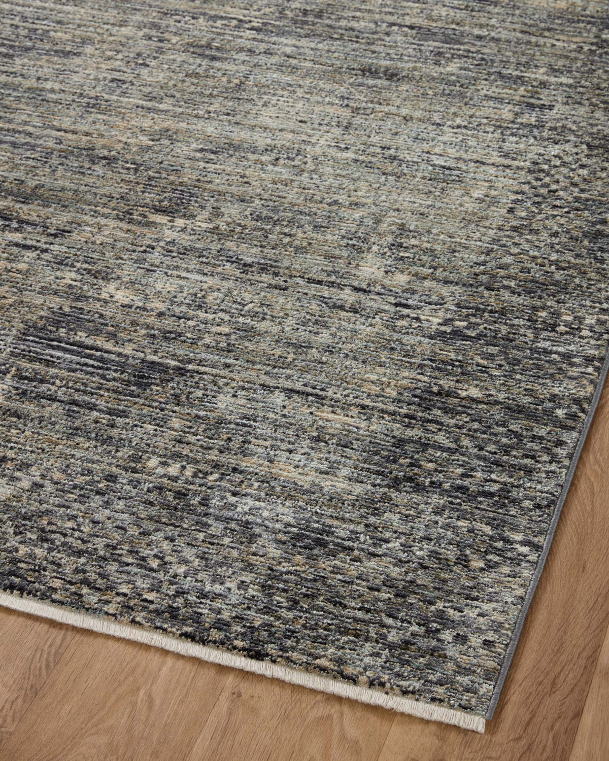 Slate gray area rug with textured abstract horizontal pattern and low-profile pile.