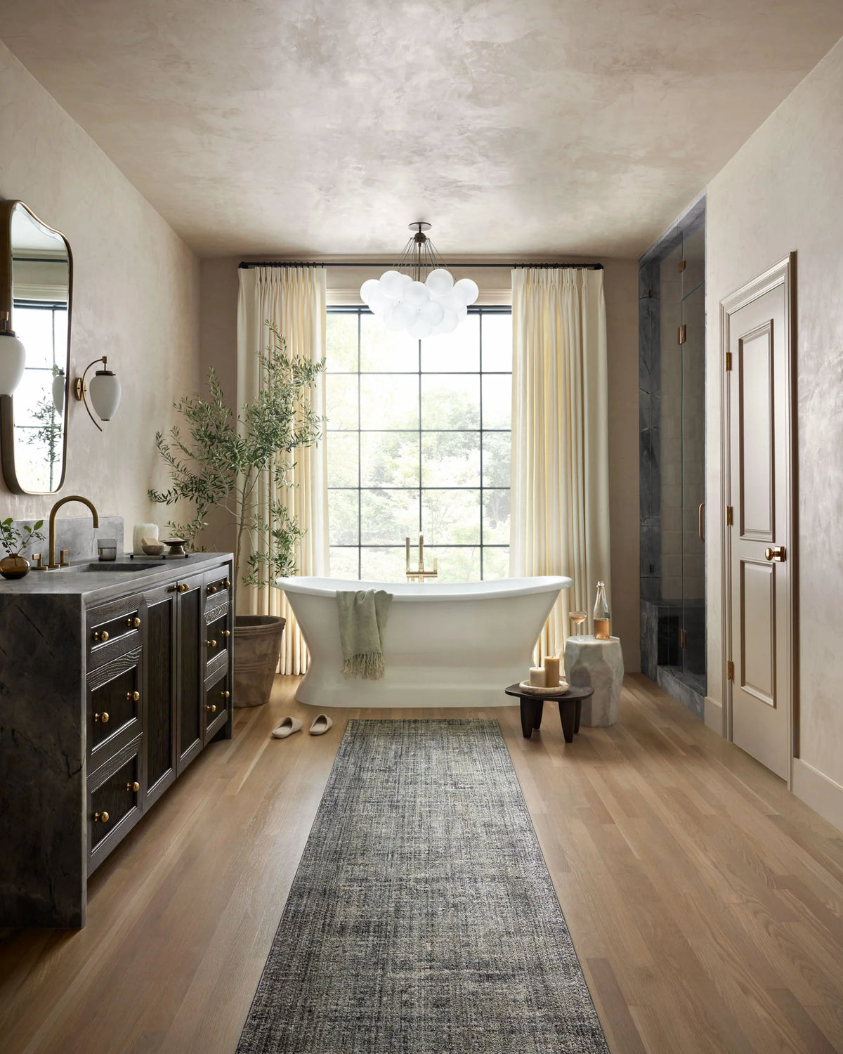 Slate blue-gray area rug with textured stripe pattern, centered on wood flooring