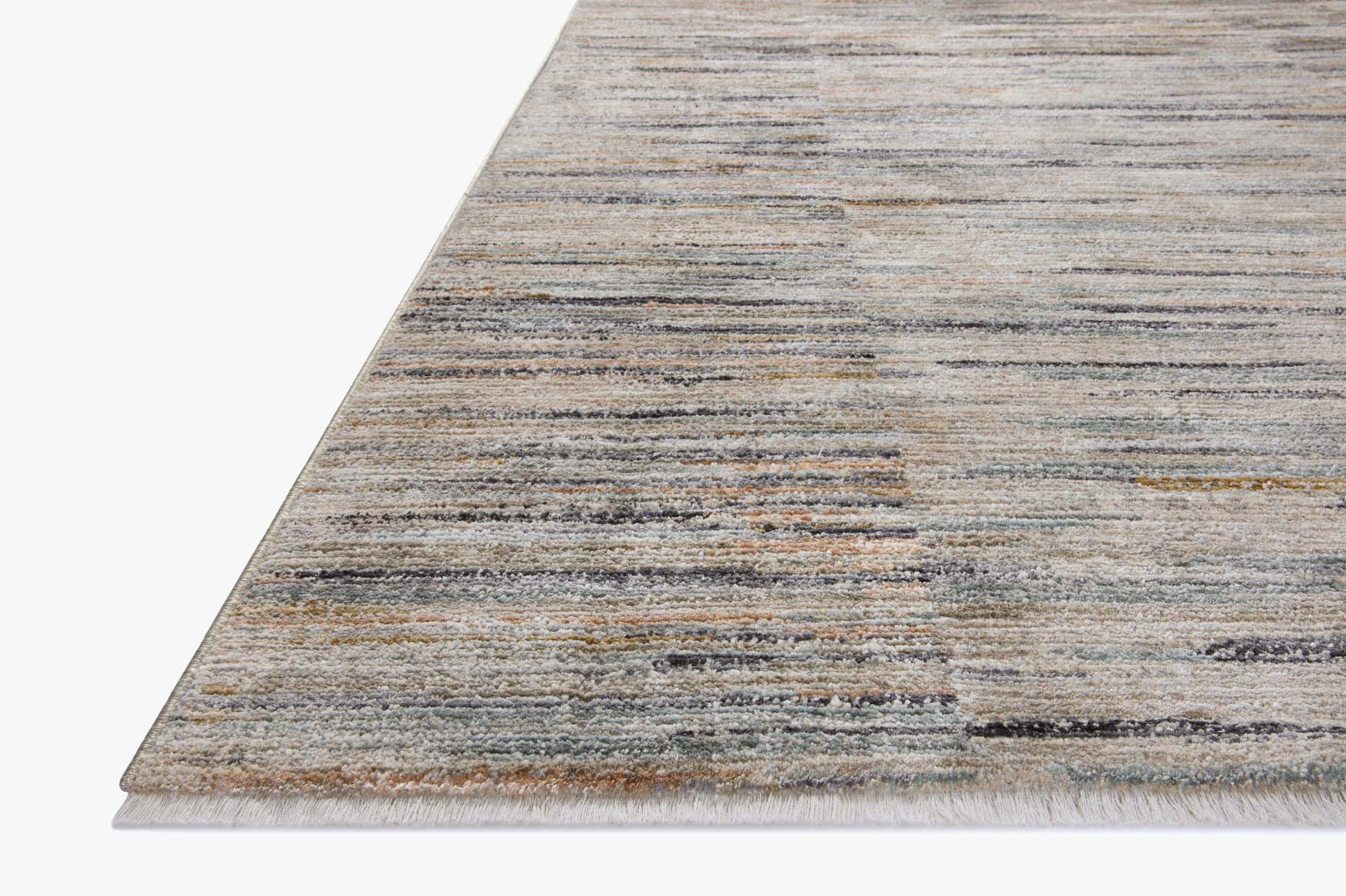 Light gray accent rug with blue and tan horizontal stripes, angled view from the corner.