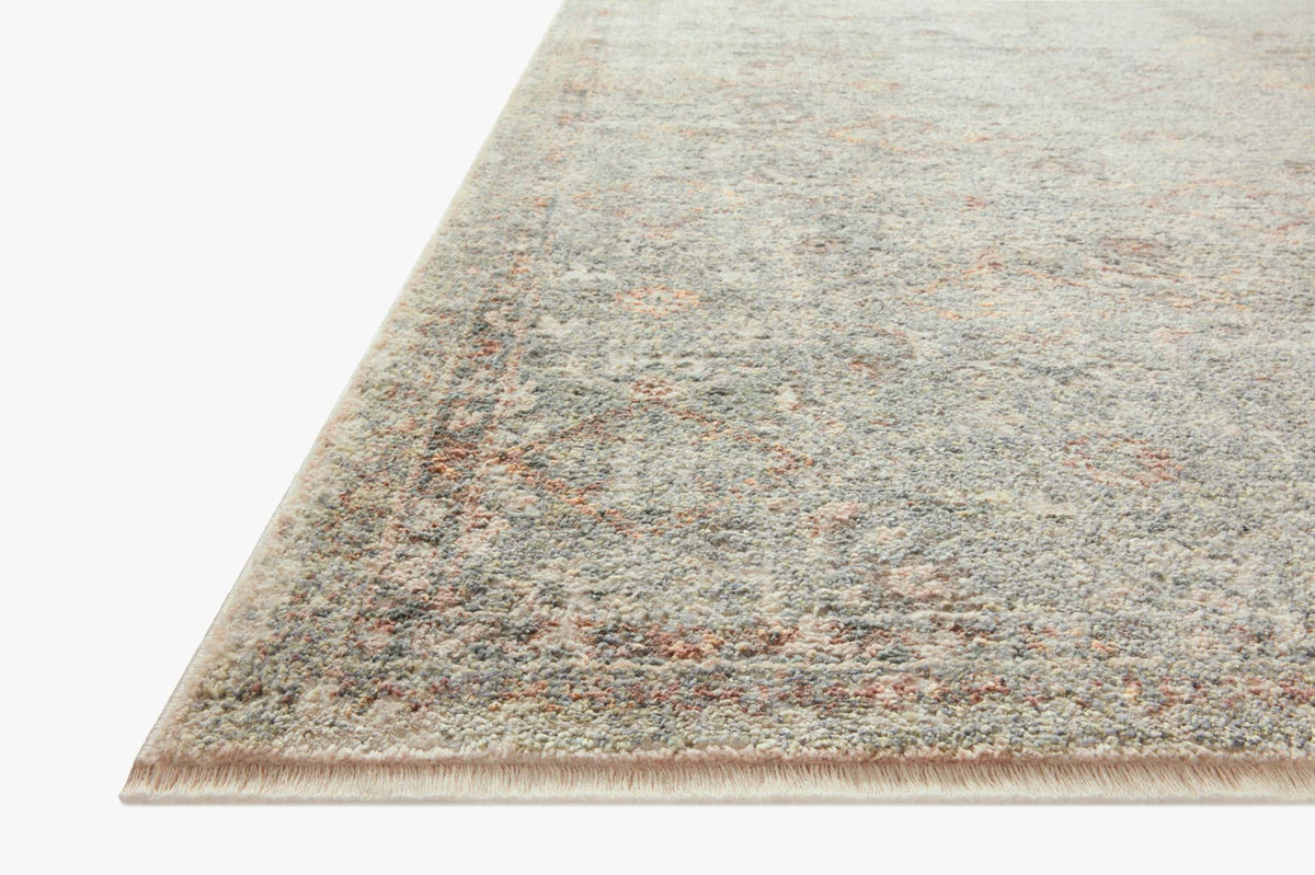 Lagoon and gold area rug with short fringe and mottled vintage pattern