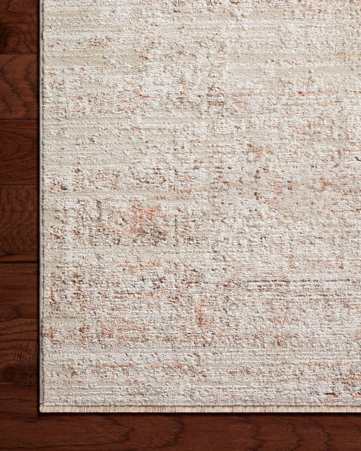 Loloi beige and terracotta area rug close-up of textured pile and border edge