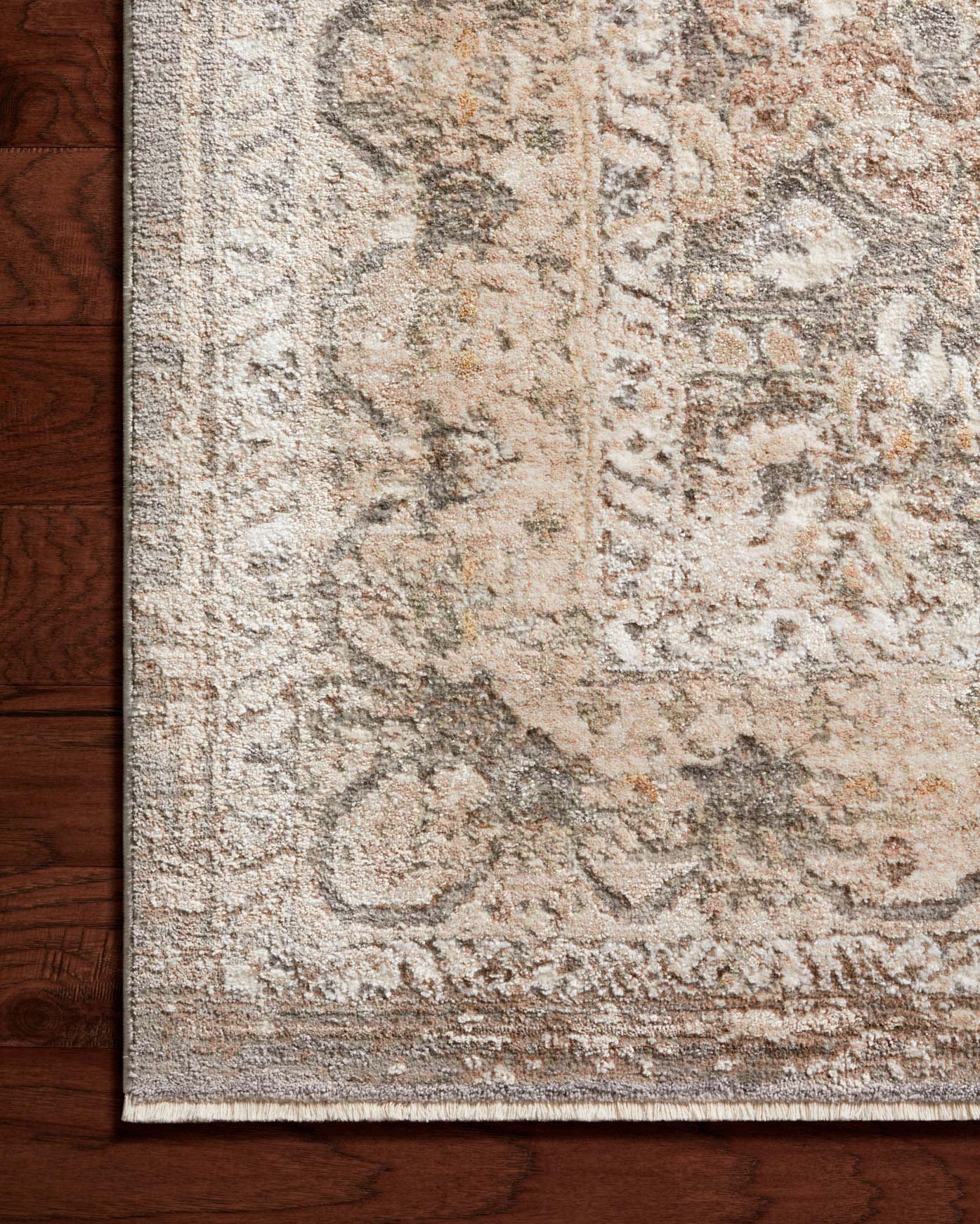 Loloi runner rug close-up of abstract textured pattern in beige and gray with border edge