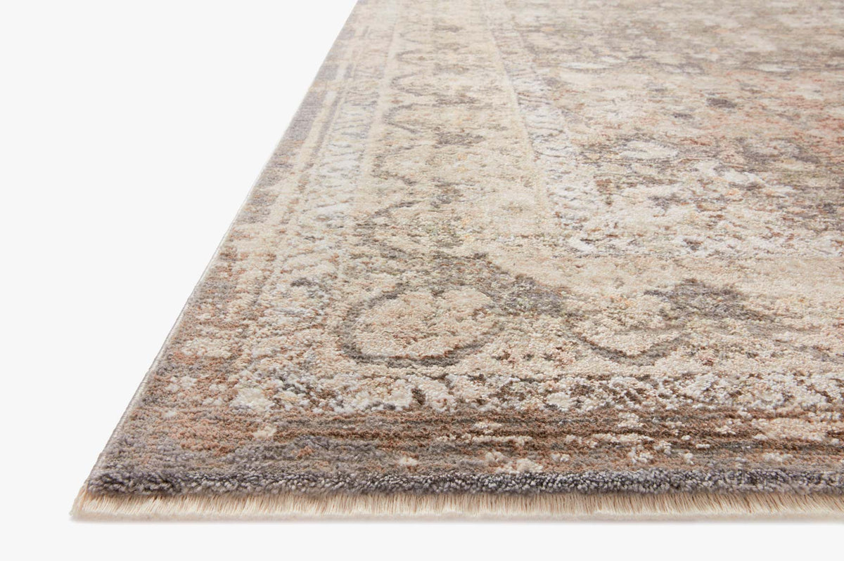Gray and sage area rug with distressed abstract pattern and short fringe edges