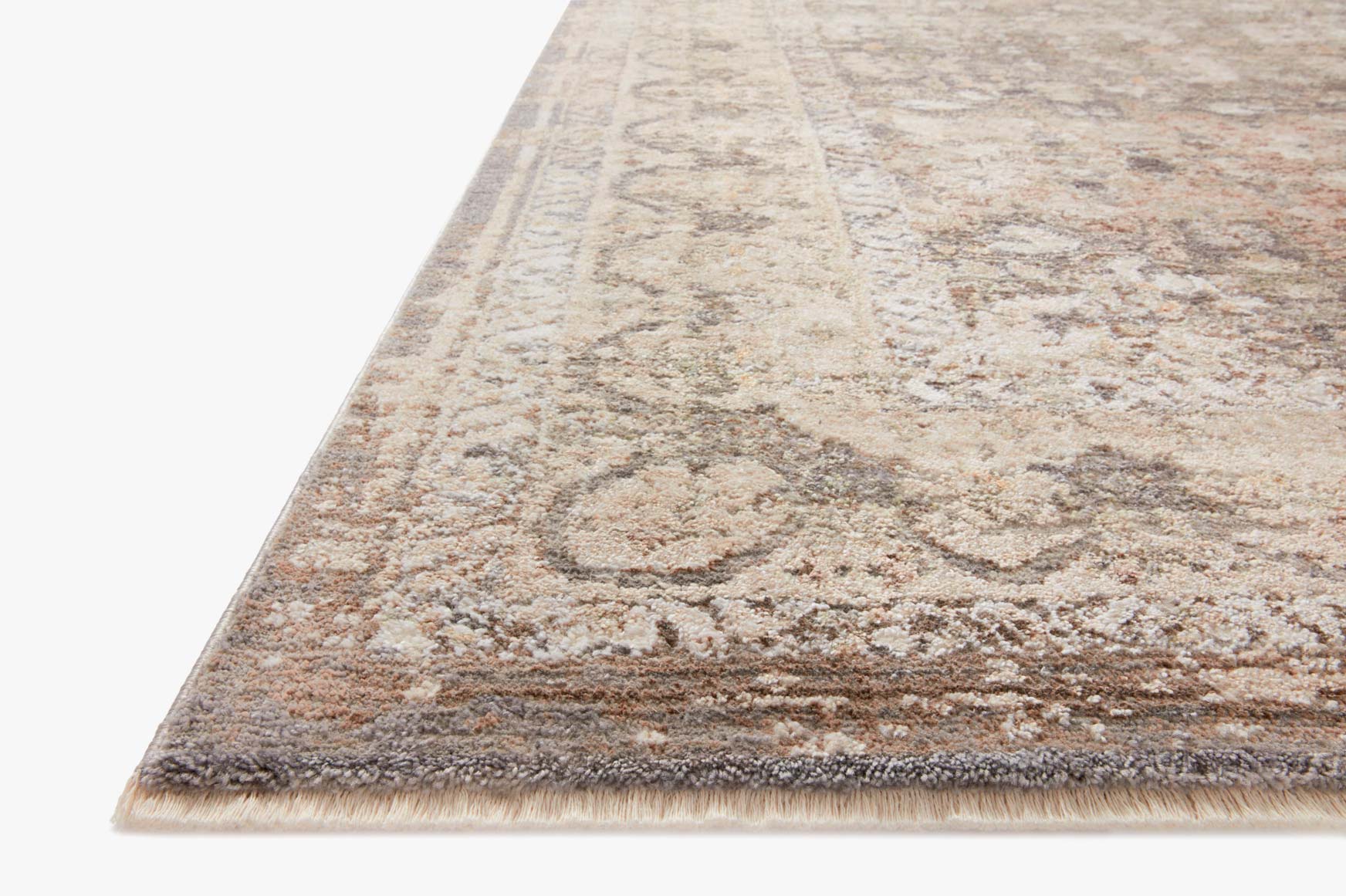 Abstract area rug with distressed pattern, gray and sage tones, short pile edge