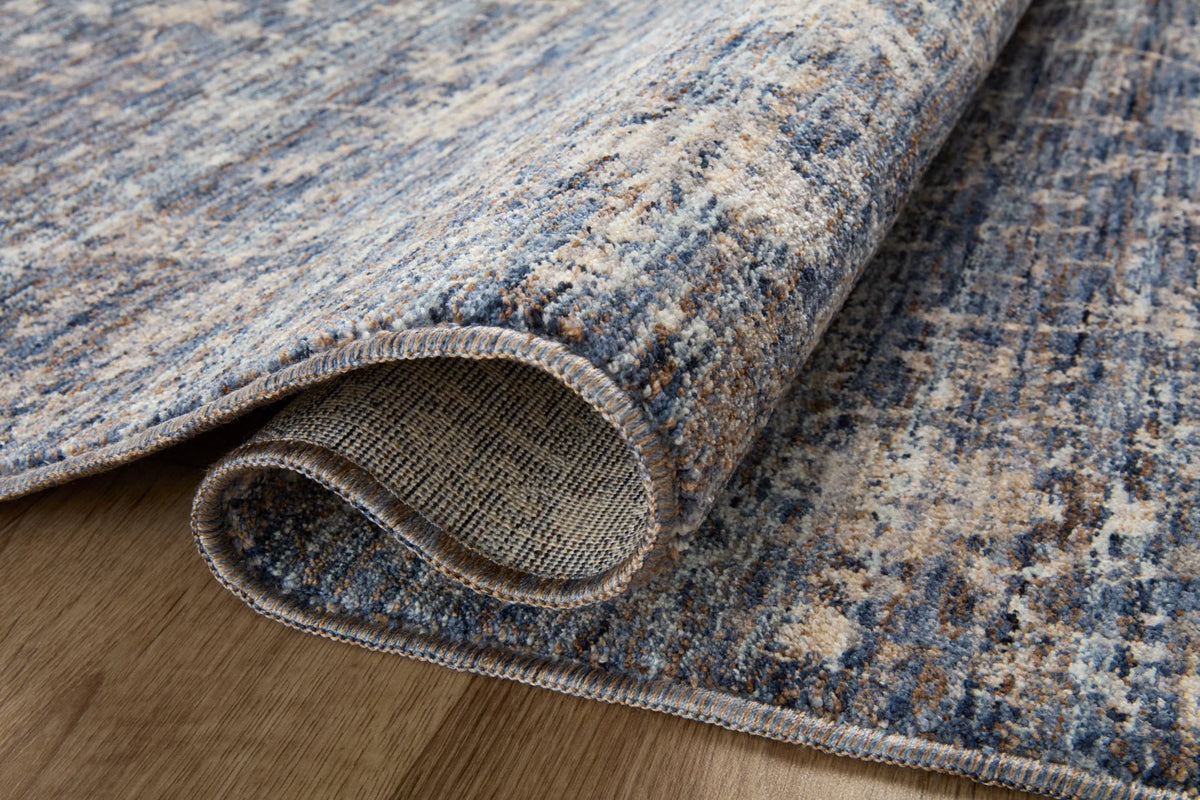 Blue and natural rug with stitched bound edge and woven texture close-up