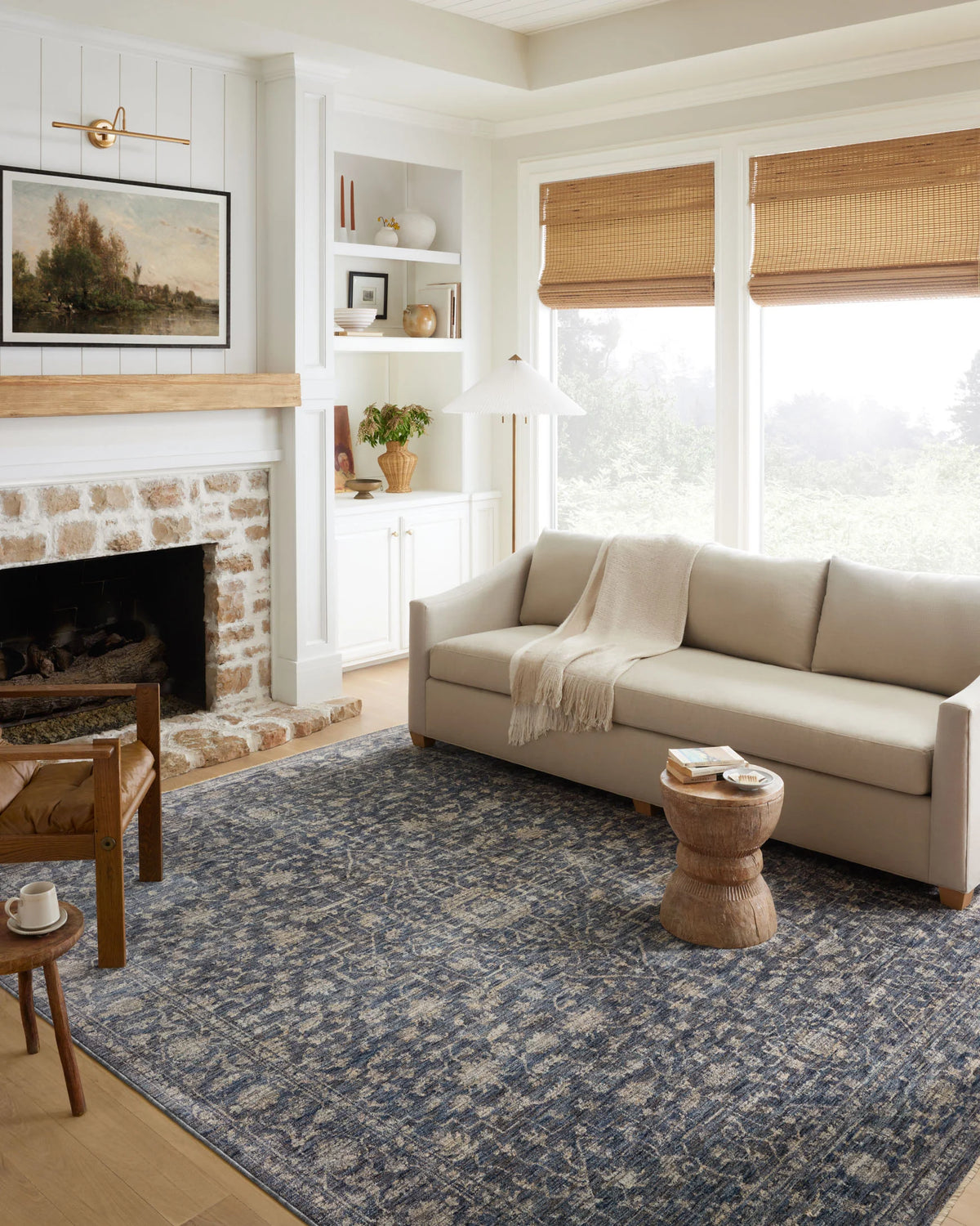 Traditional runner rug on hardwood floor, blue and natural distressed motif