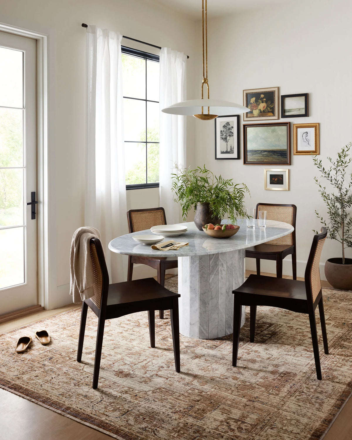 Mocha and tan traditional accent rug in a living room dining area