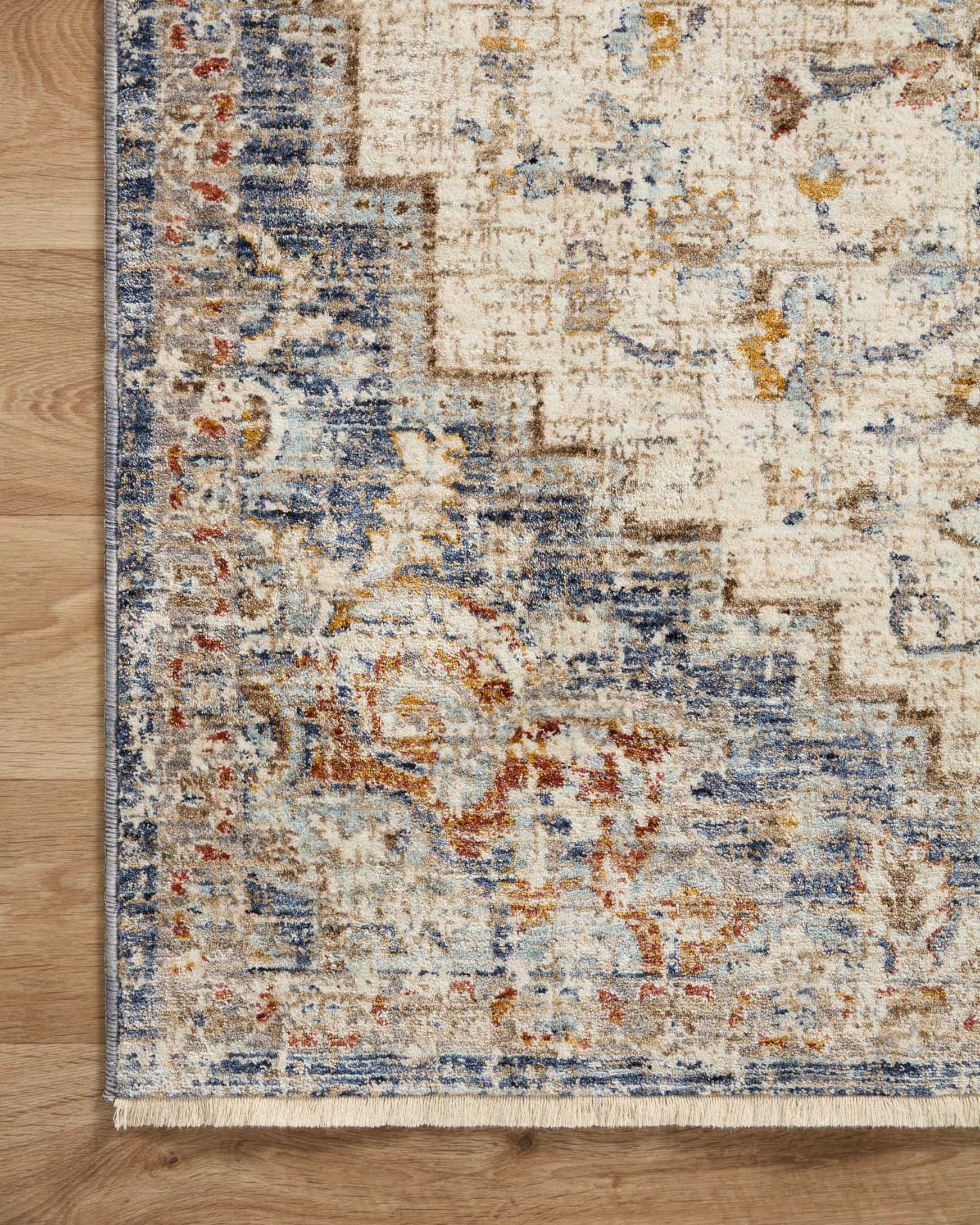 Rectangular traditional area rug with ivory ground, blue and orange vintage-style pattern