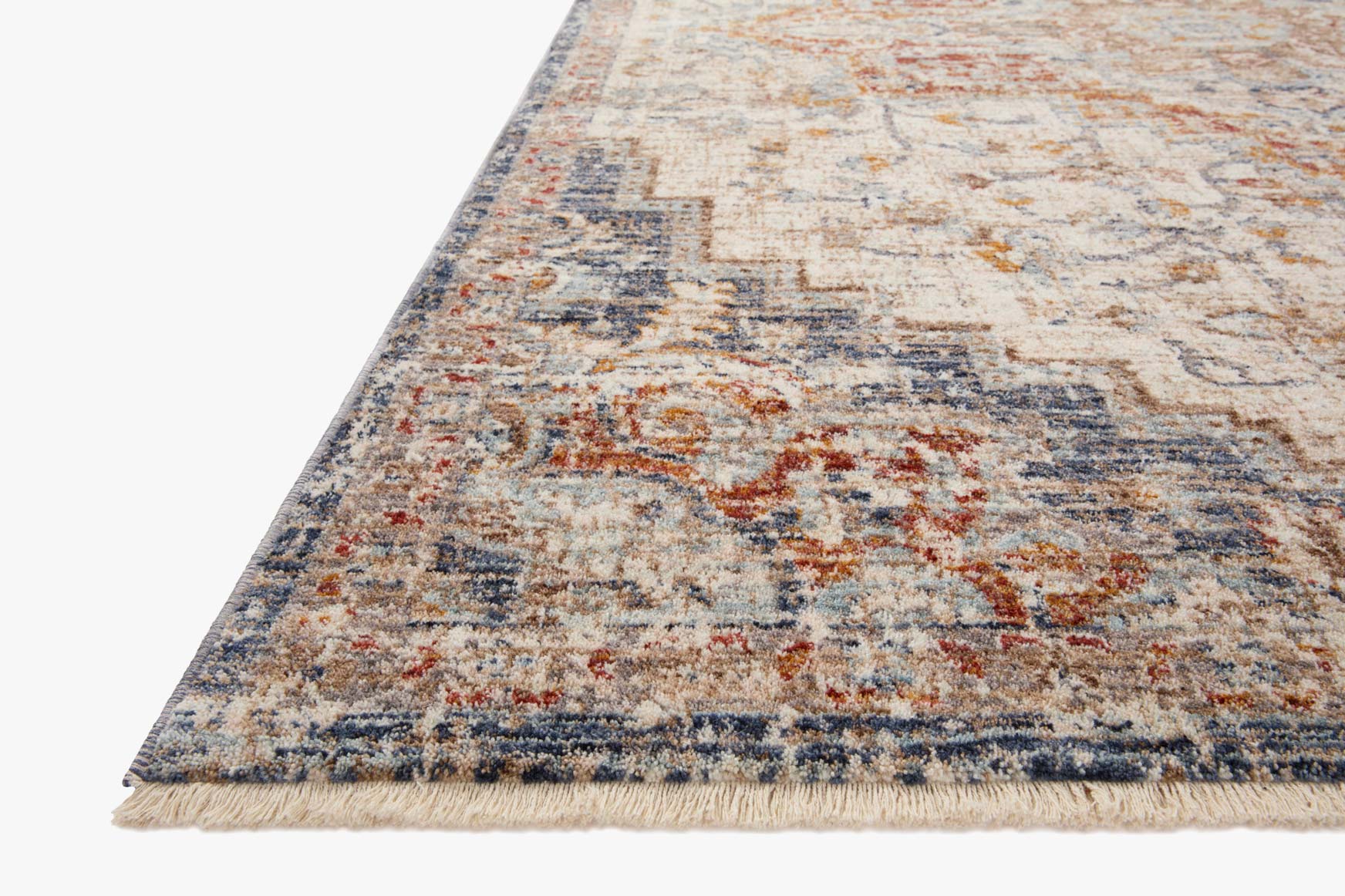 Ivory traditional area rug with blue and orange distressed geometric motifs and fringe edges