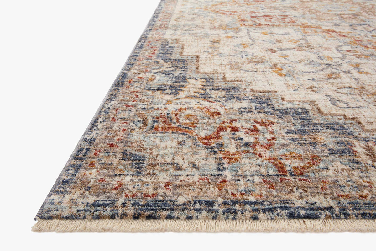 Traditional accent rug with ivory base, orange and blue distressed pattern, serged edge