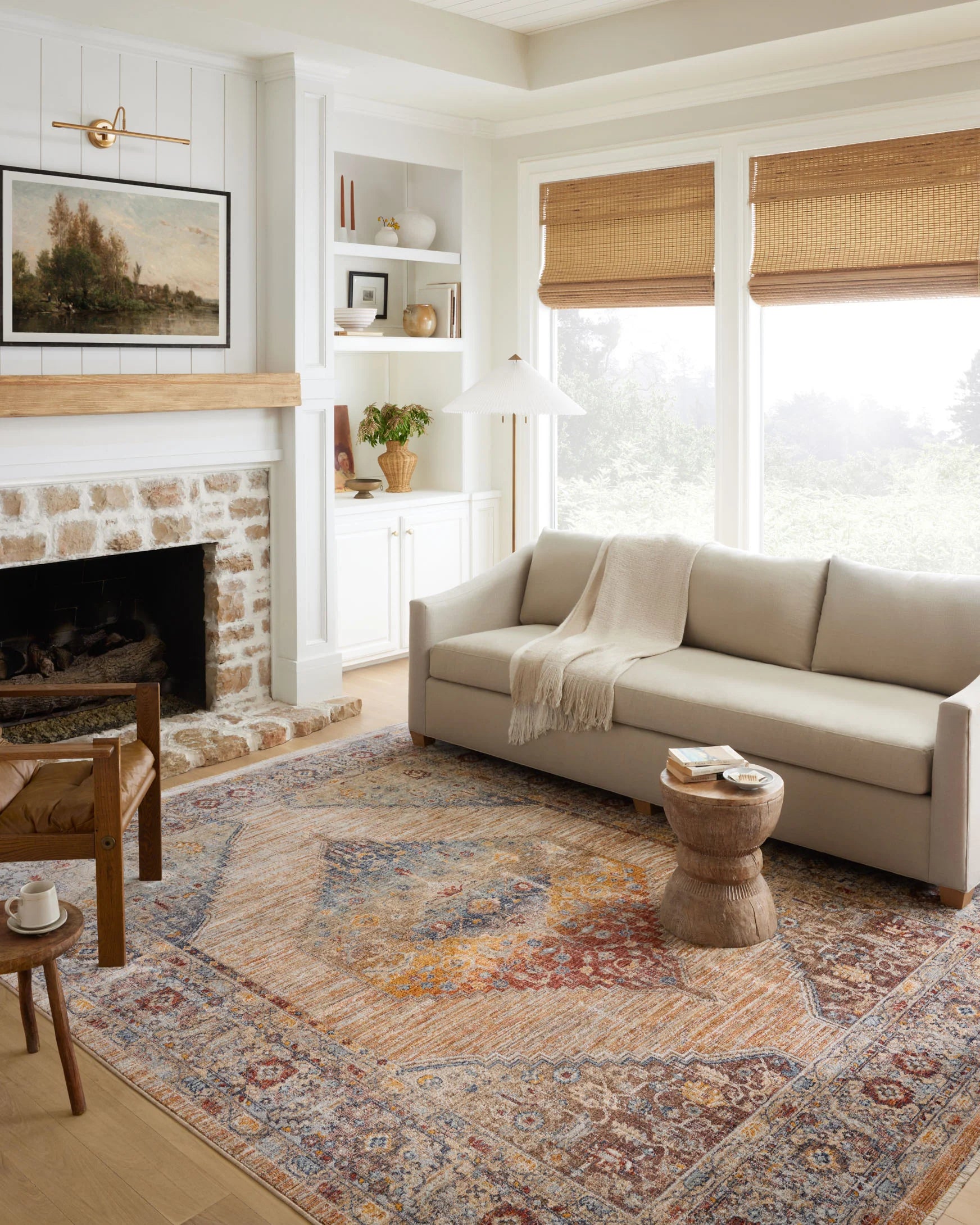 Traditional distressed area rug, cream field with blue and rust medallions and border
