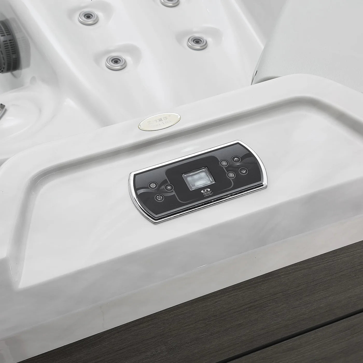 Square outdoor hot tub control panel on rim with buttons and small display