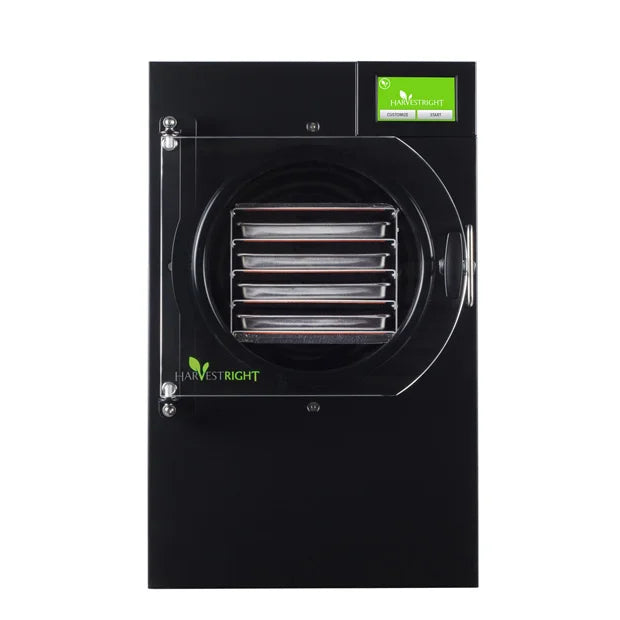 Black home freeze dryer with circular vacuum chamber and front tray rack