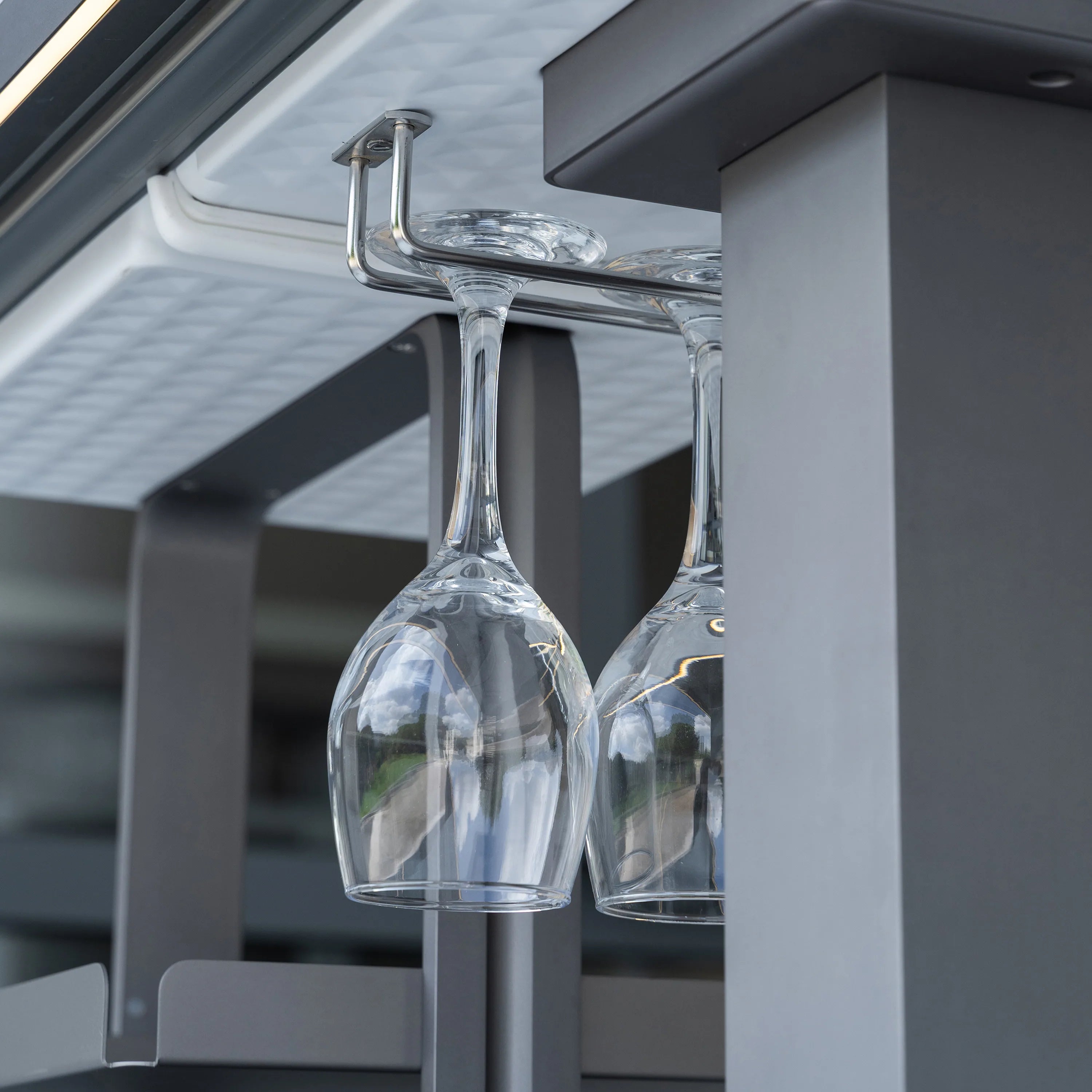 Smart dining table dispenser with clear glass carafes and chrome spigot