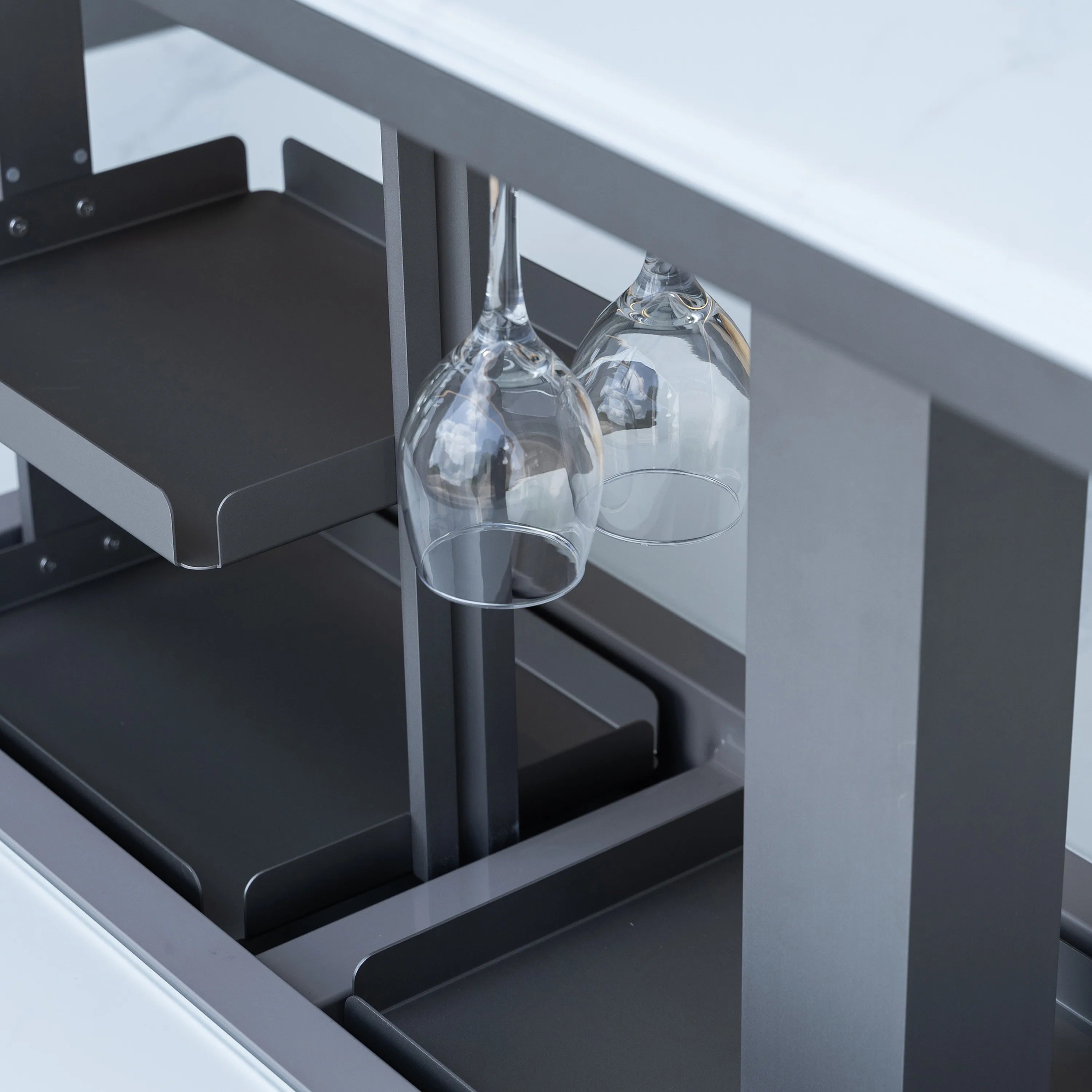 Smart dining table interior with wine glasses in bottle rack holders