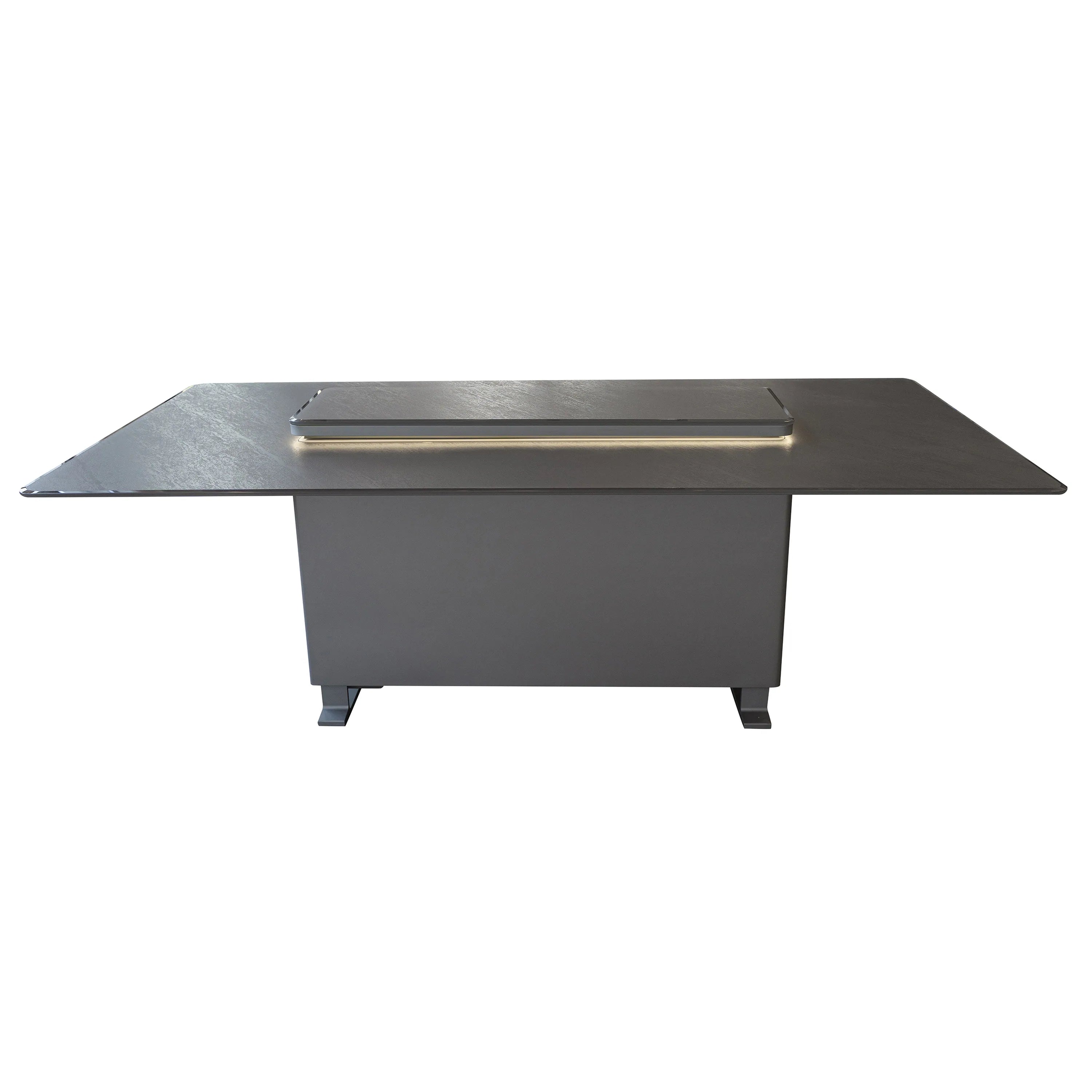 Outdoor dining table with dark stone top and recessed warming tray with glass lid