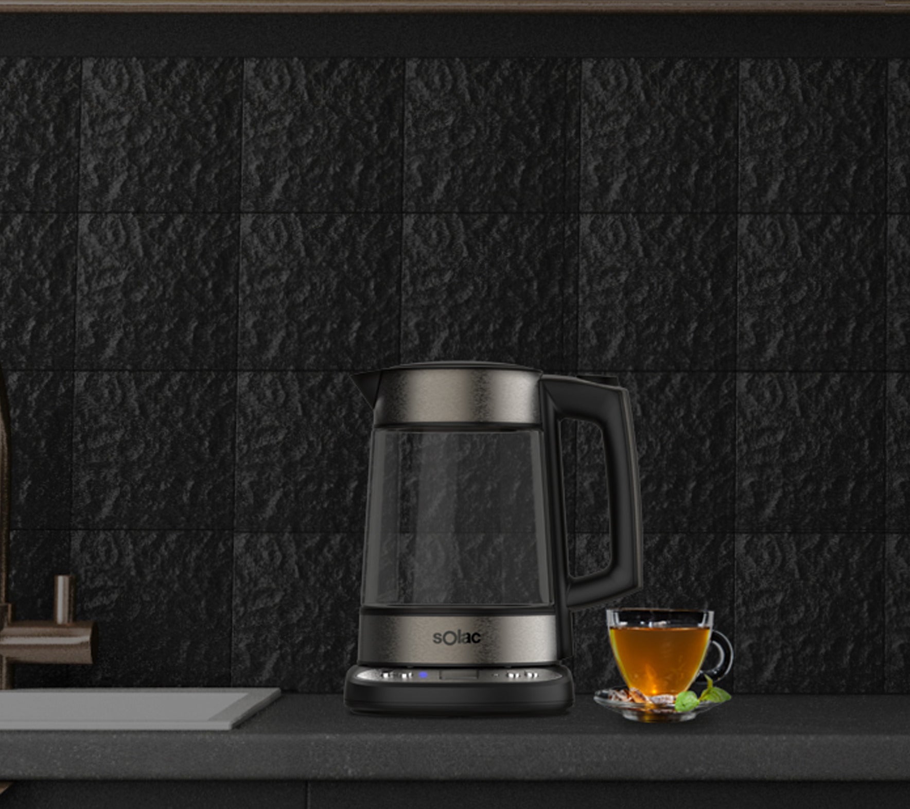 Glass kettle with black lid and handle, electric base with controls