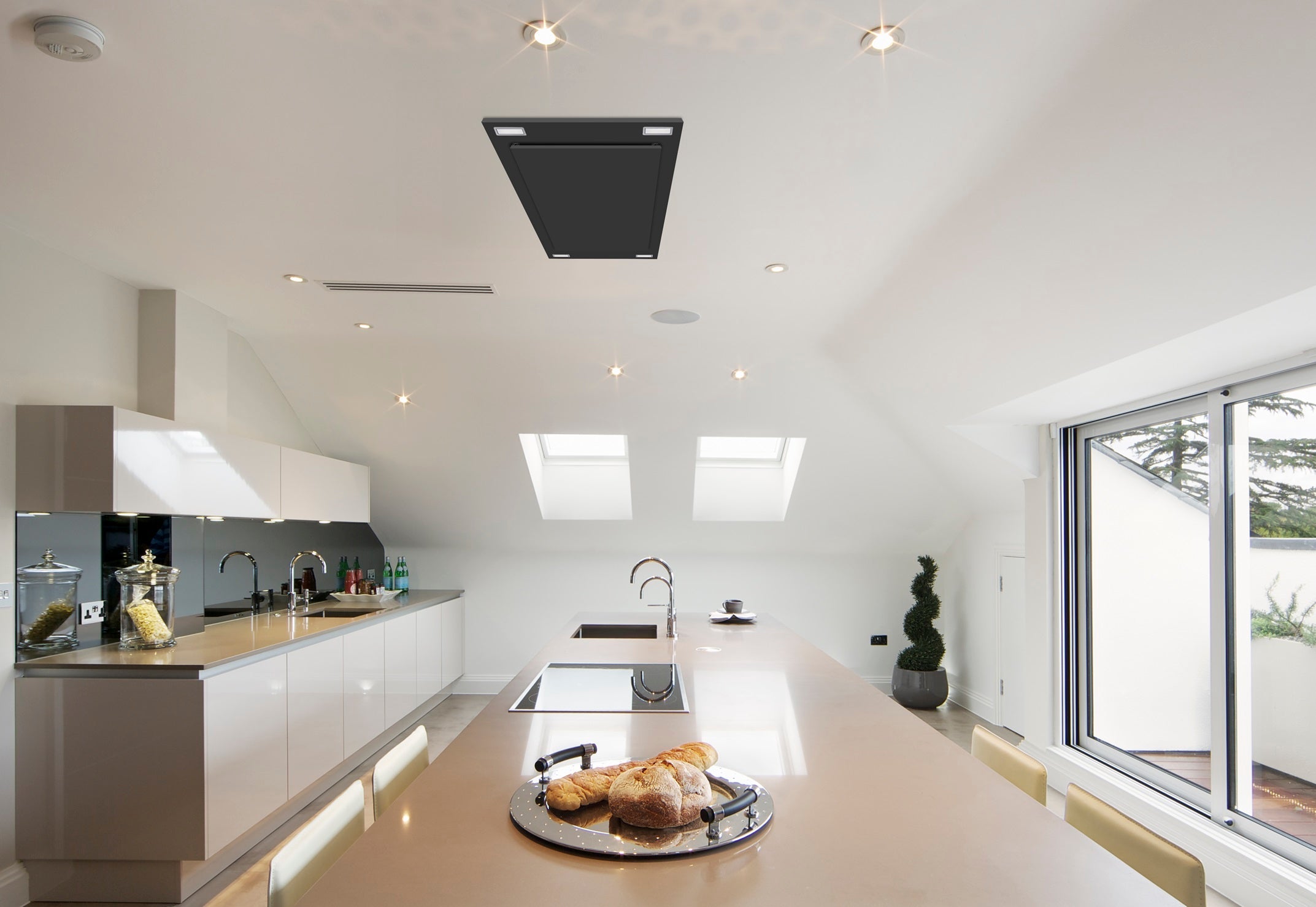 Black flush-mount ceiling range hood with modern LED lights above a cooktop