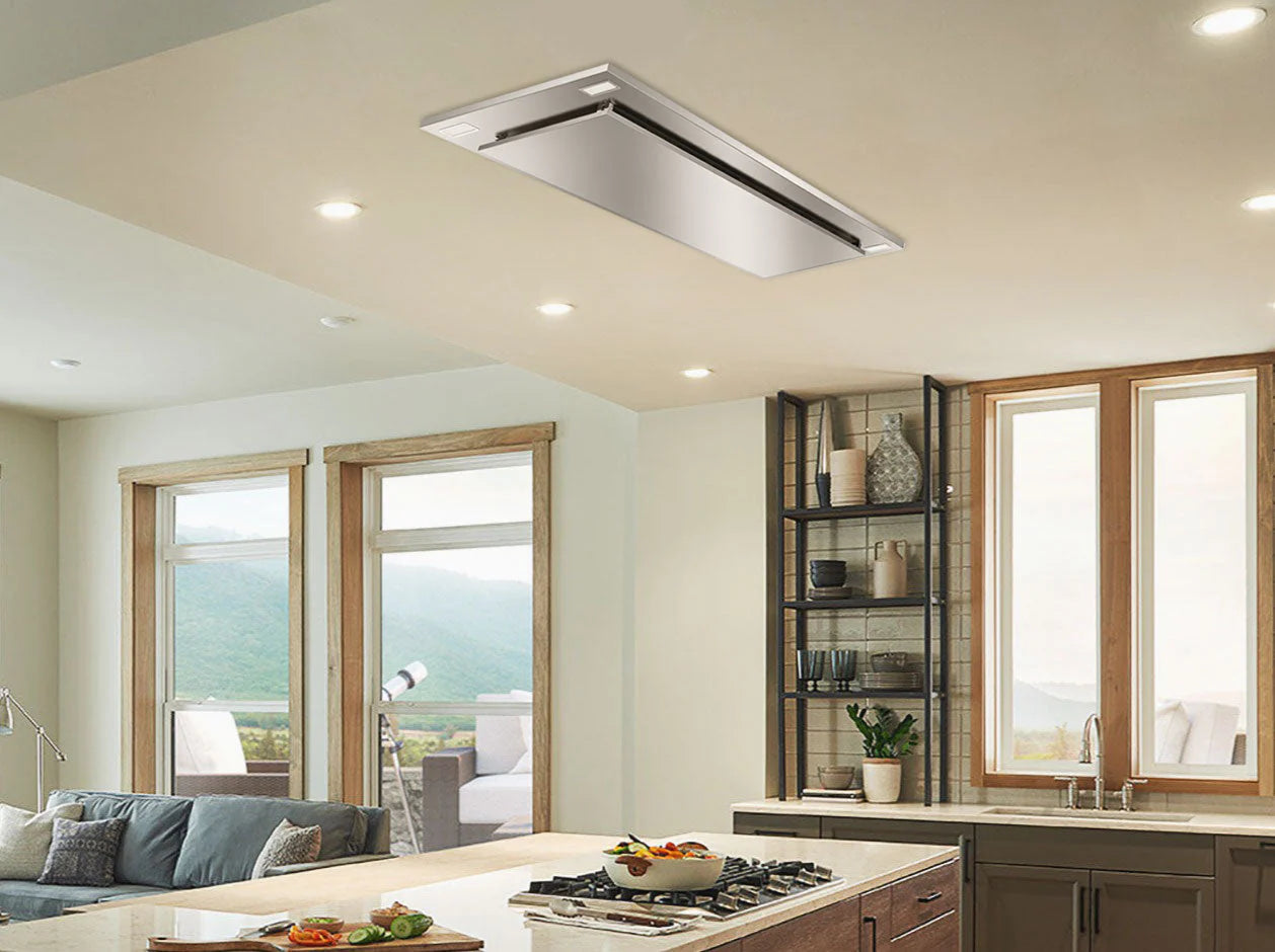 Flush ceiling mount range hood installed above the stove in a modern kitchen