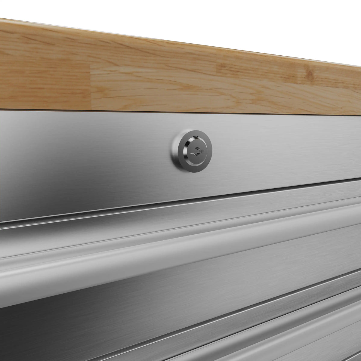 Brushed metal drawer front with circular chrome handle and defined drawer seams