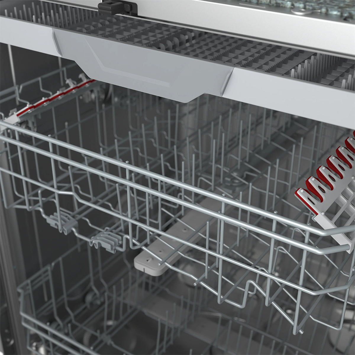 Close-up of dishwasher lower rack with silver metal tines and support pieces