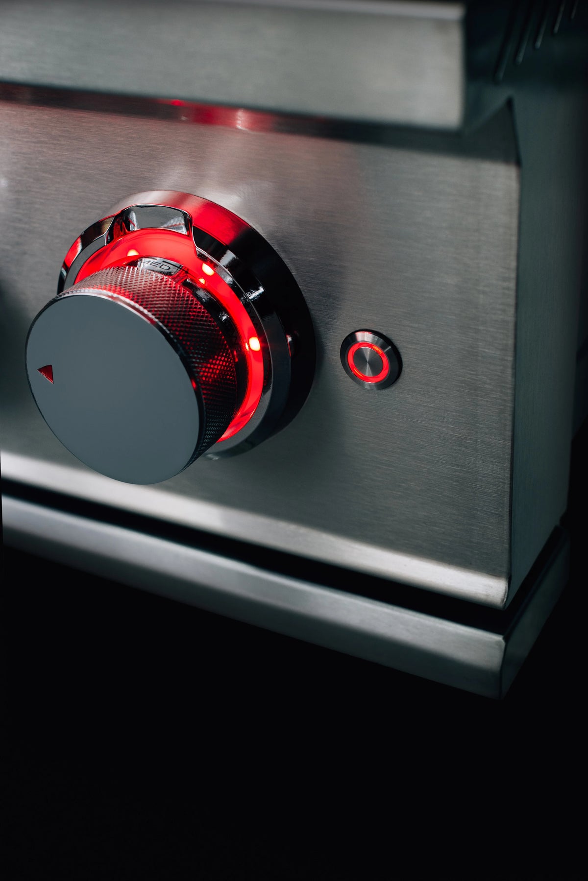 Stainless steel double natural gas side burner, red control knob and ignition area