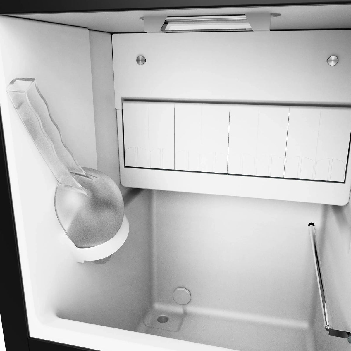 Ice maker interior with ice bin and front dispensing area
