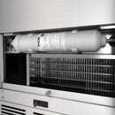 Thor ice maker drain pump assembly with white canister and metal cooling grille