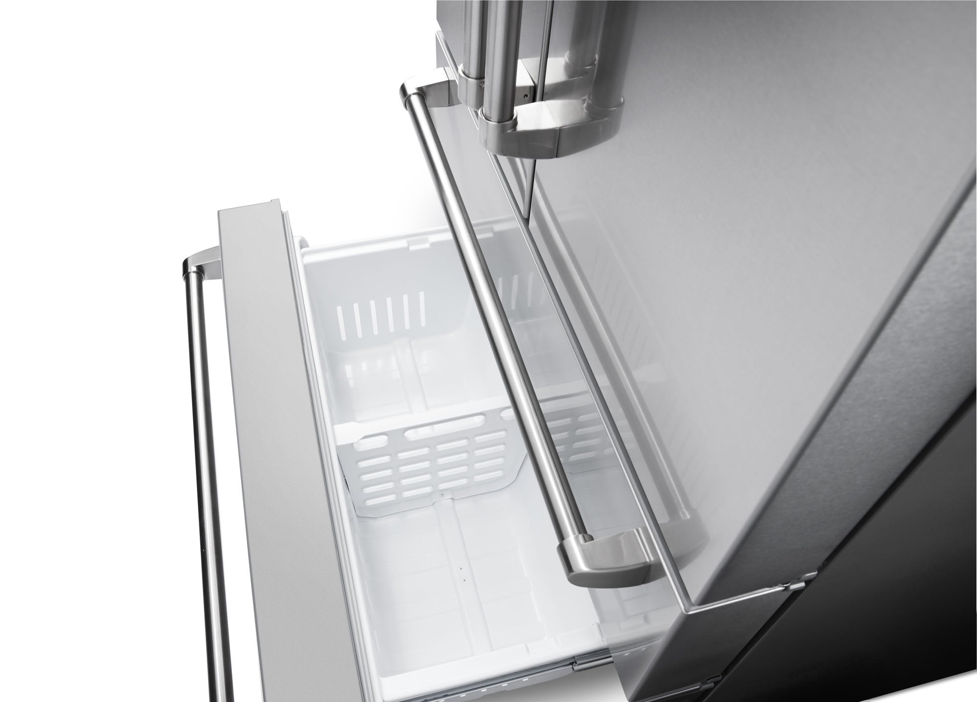 Freezer compartment interior with ice maker chute and plastic bin shelves.