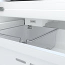 Ice maker area inside stainless 36-inch refrigerator with pull-out shelf
