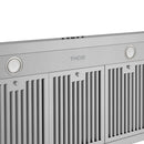 Stainless steel range hood front panel with THOR logo, round buttons, and vent slats