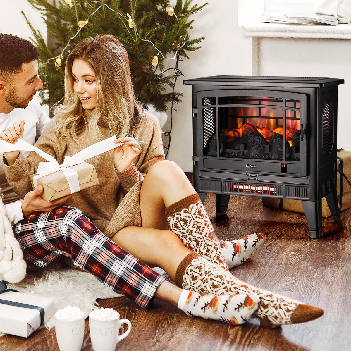 Black electric fireplace stove with flame effect, remote and smartphone in view
