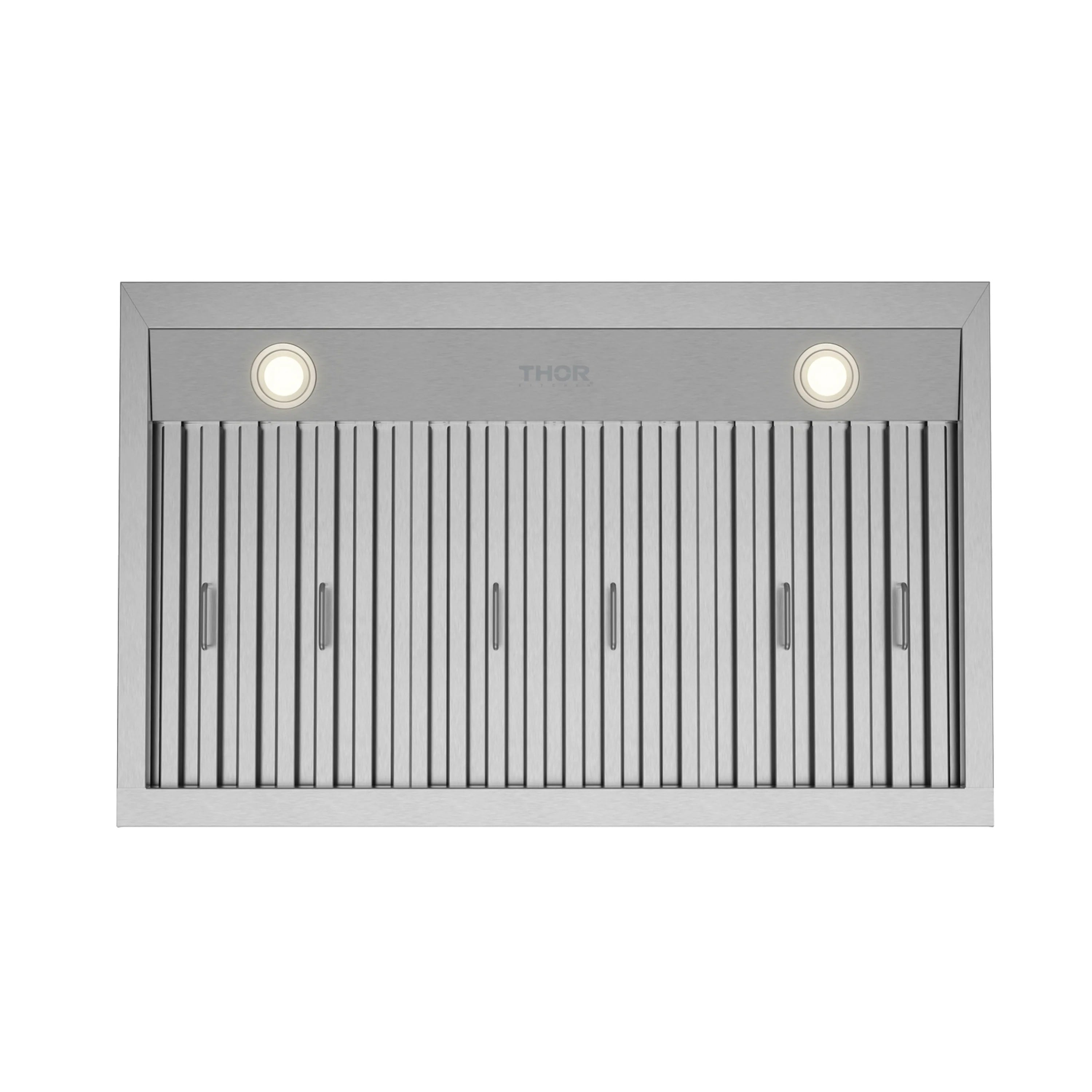 Under-mount range hood underside with lit LED bulbs and vertical baffle filters