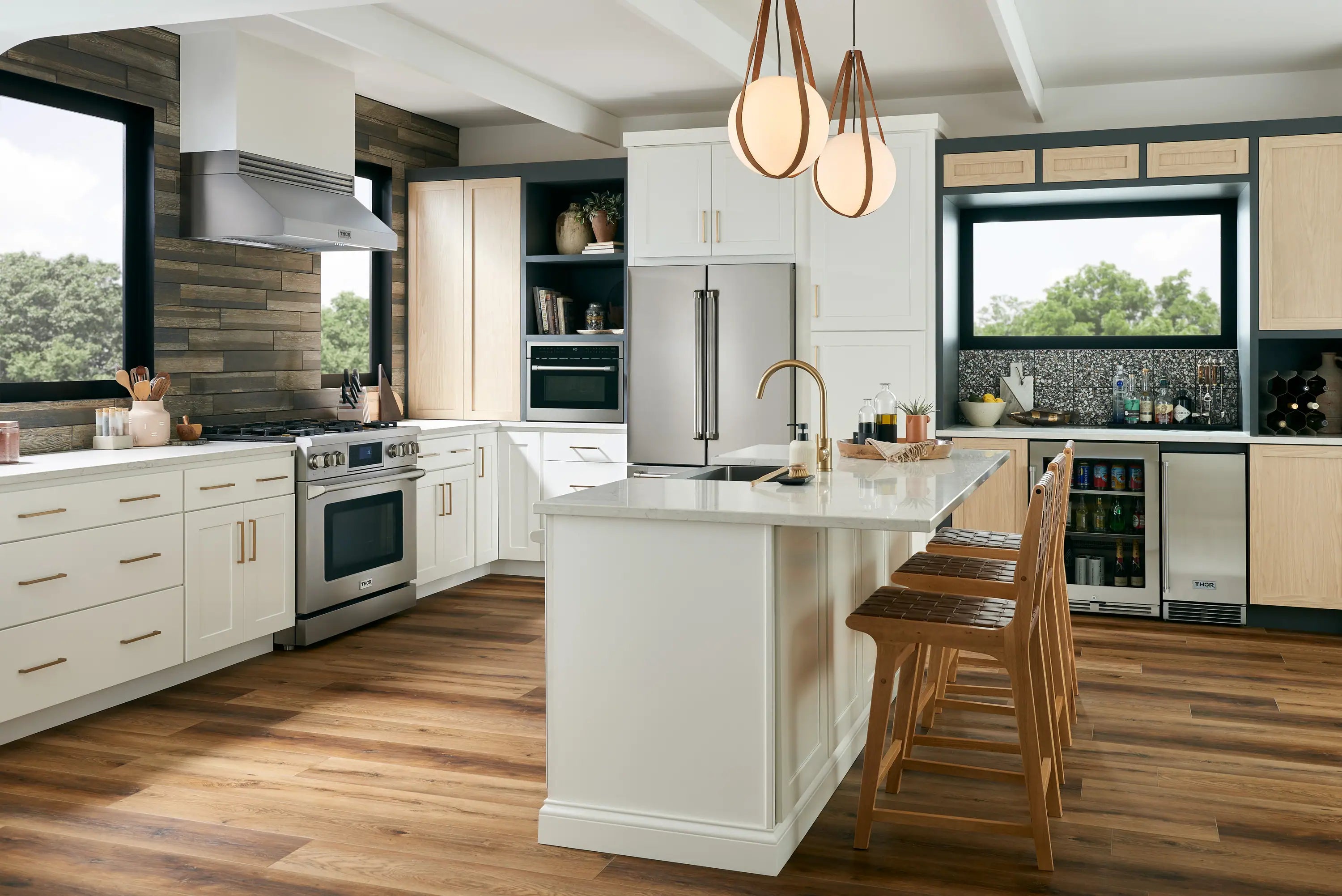 Built-in stainless ice maker installed under countertop in a modern kitchen