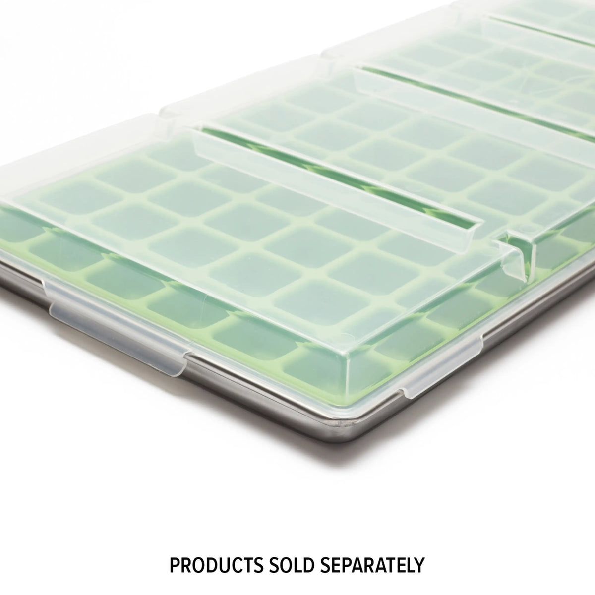 Large clear tray lid with grid-like pattern visible beneath, snap edges