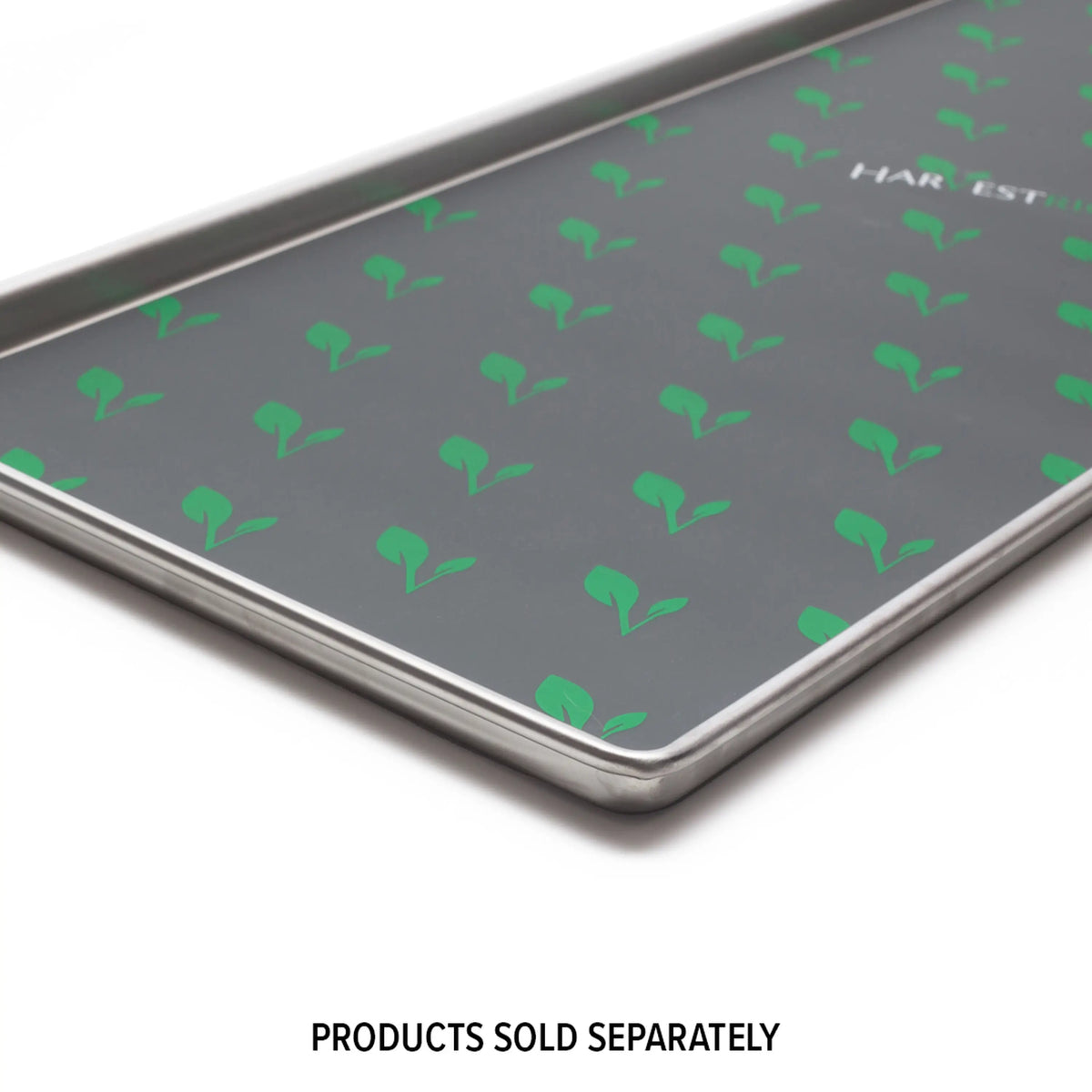 Dark gray freeze dryer tray with green logo pattern and metal edges