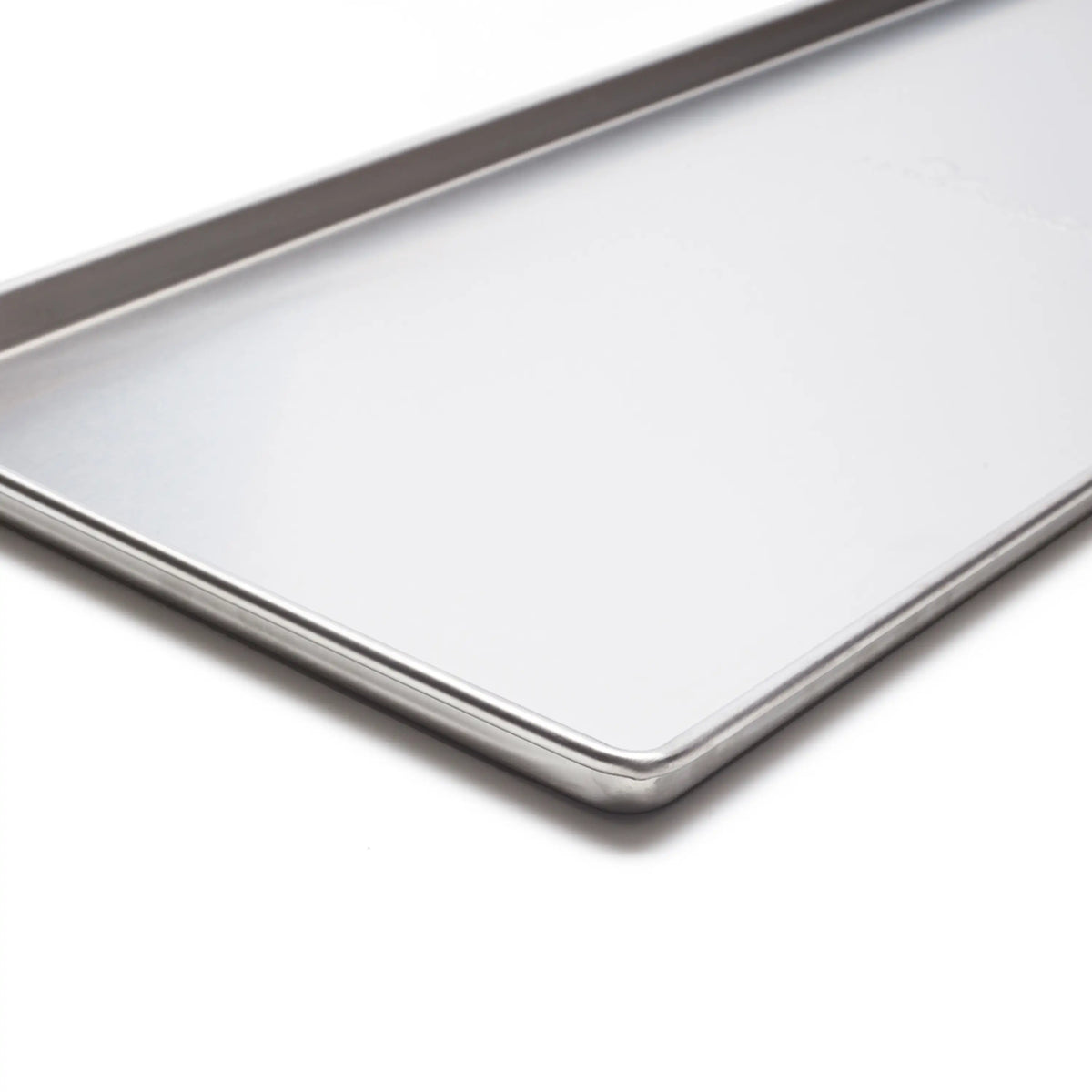Light gray freeze dryer tray with stainless-steel rim and corner seam