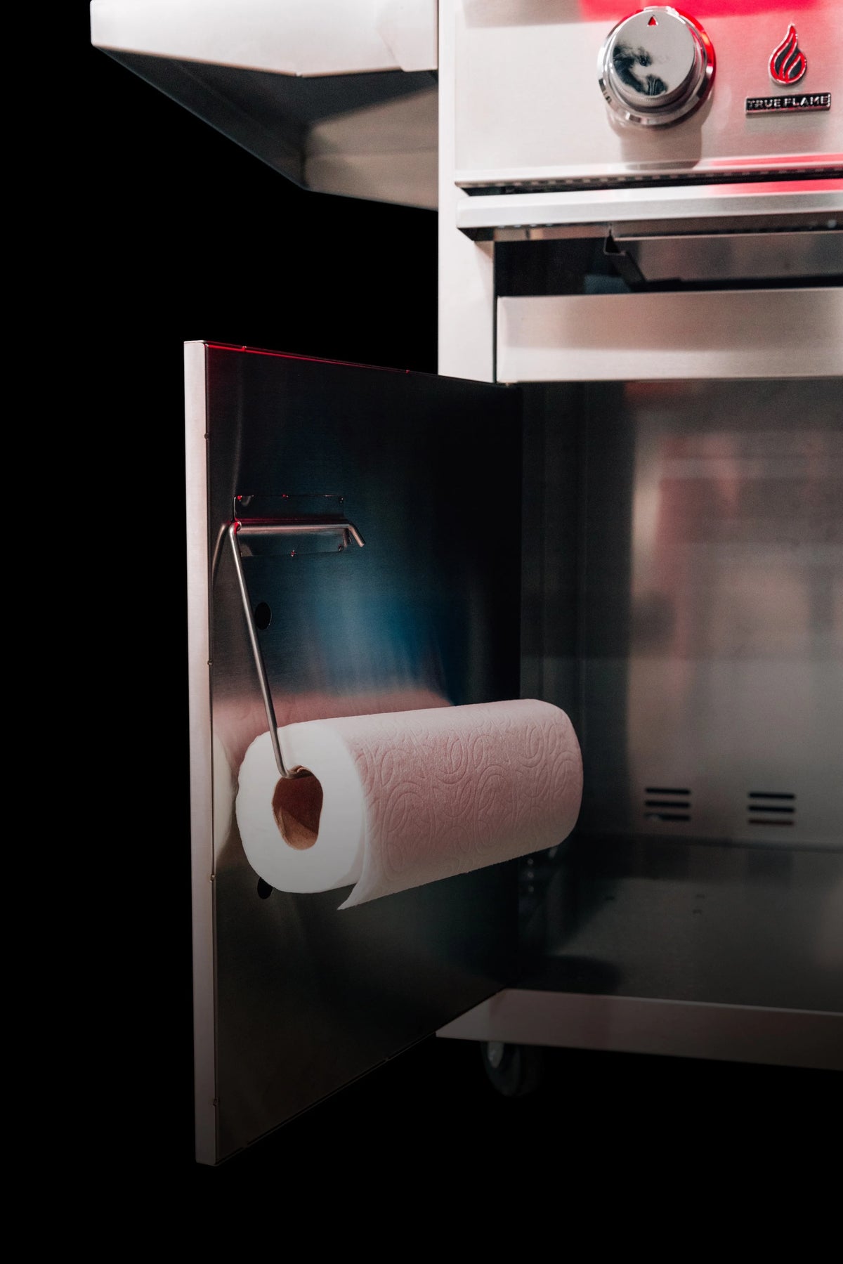 Stainless steel side cabinet with mounted paper towel roll holder