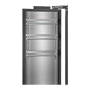 Stainless freezer column door open showing interior racks and wire baskets