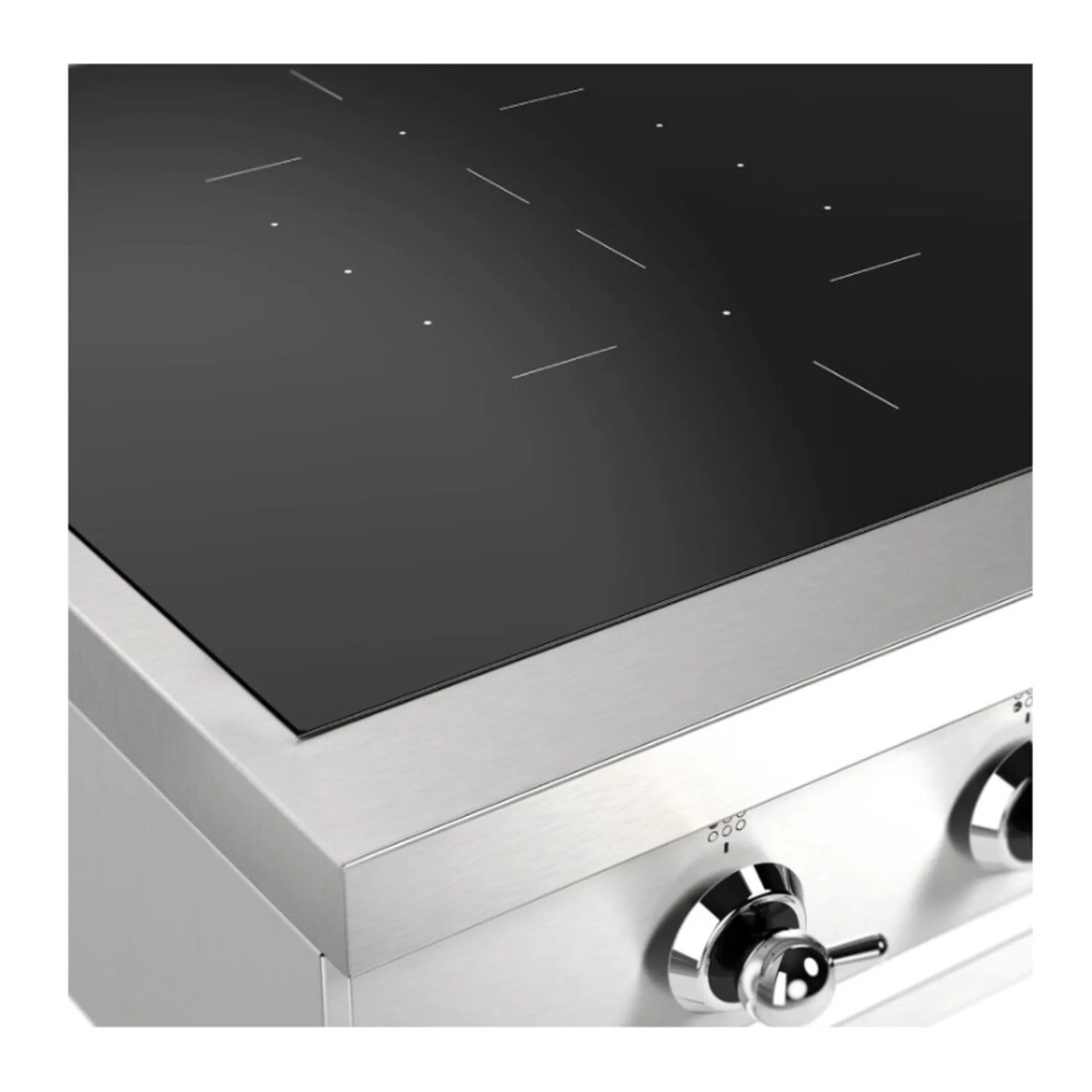 Induction cooktop close-up of black glass surface and stainless steel side with knob