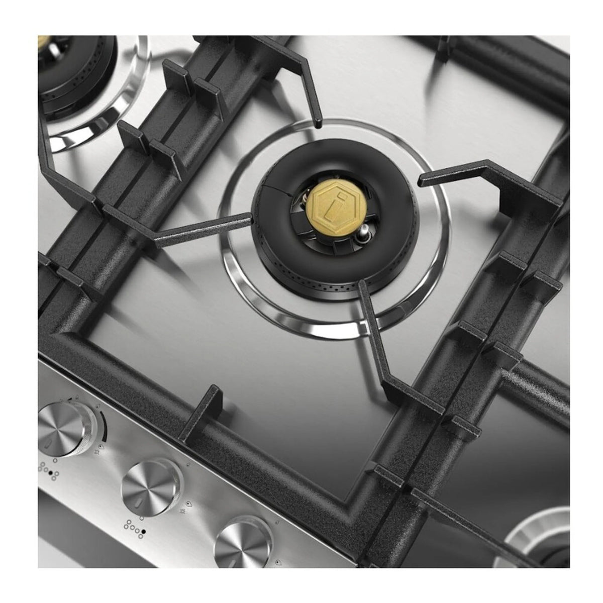 Overhead view of brass-cap burner on stainless steel gas cooktop with black grate
