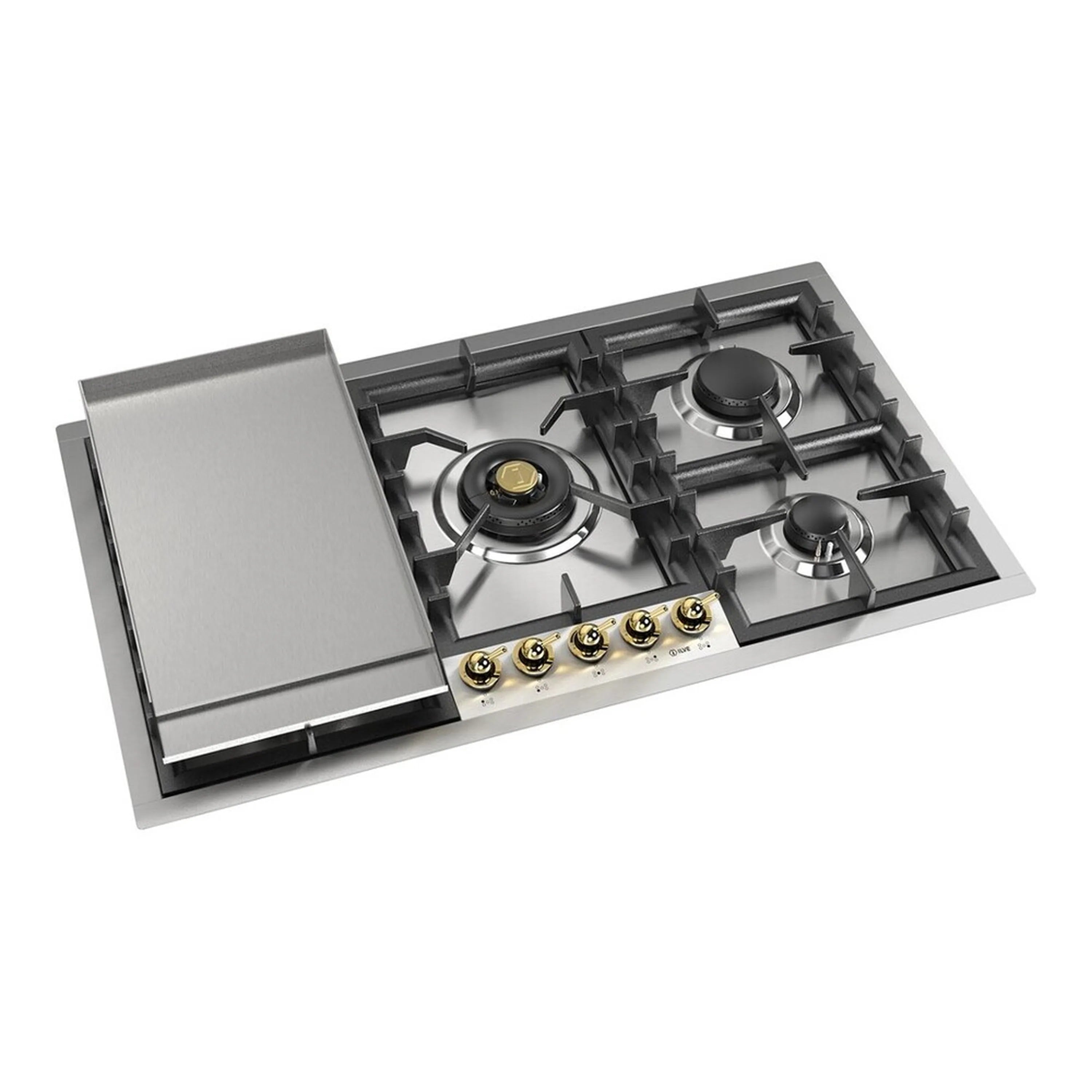 Stainless steel built-in gas cooktop with black grates, brass knobs, and burners