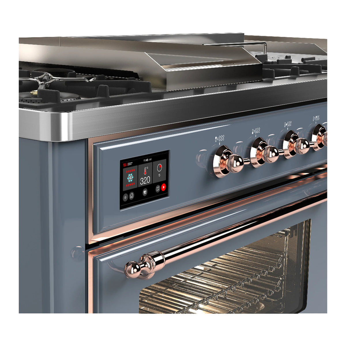 Blue-gray dual fuel range close-up of copper control knobs and open oven door heating area