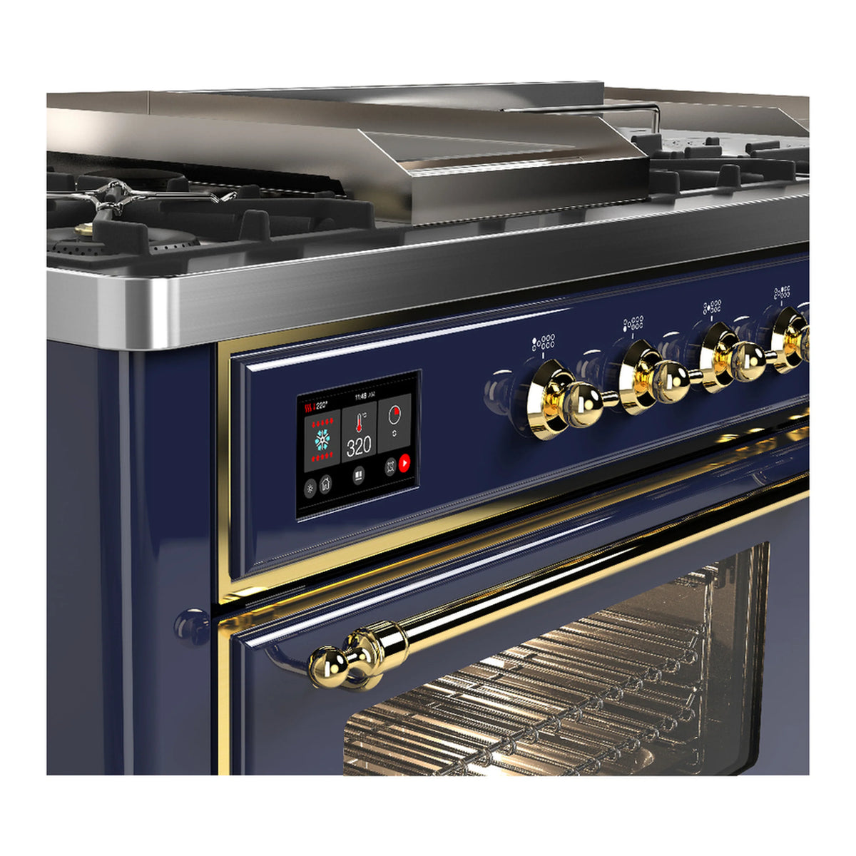 Dual fuel range close-up of blue panel controls with brass knobs and open oven heating area