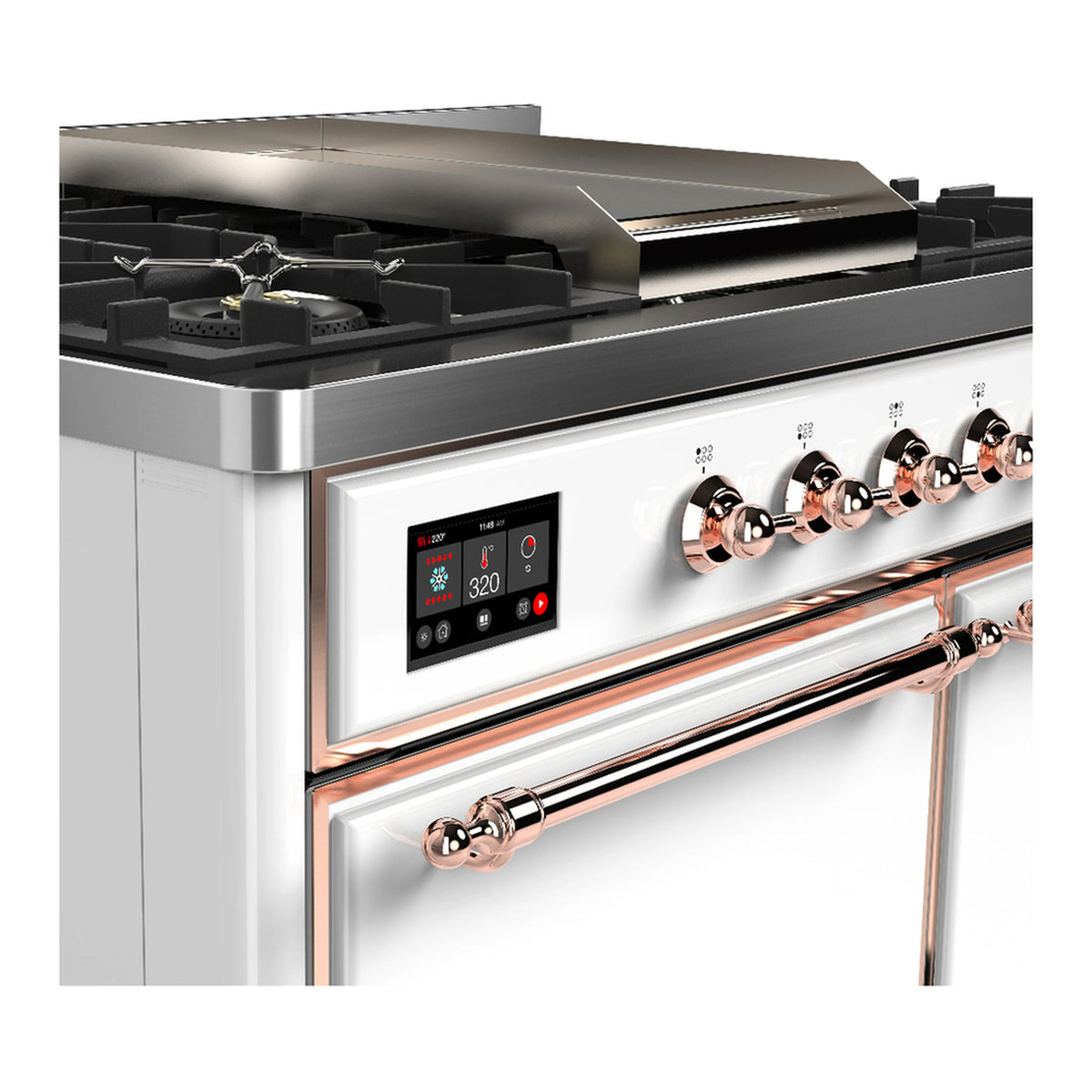 Dual fuel range close-up of black control panel with copper knobs and metal griddle edge
